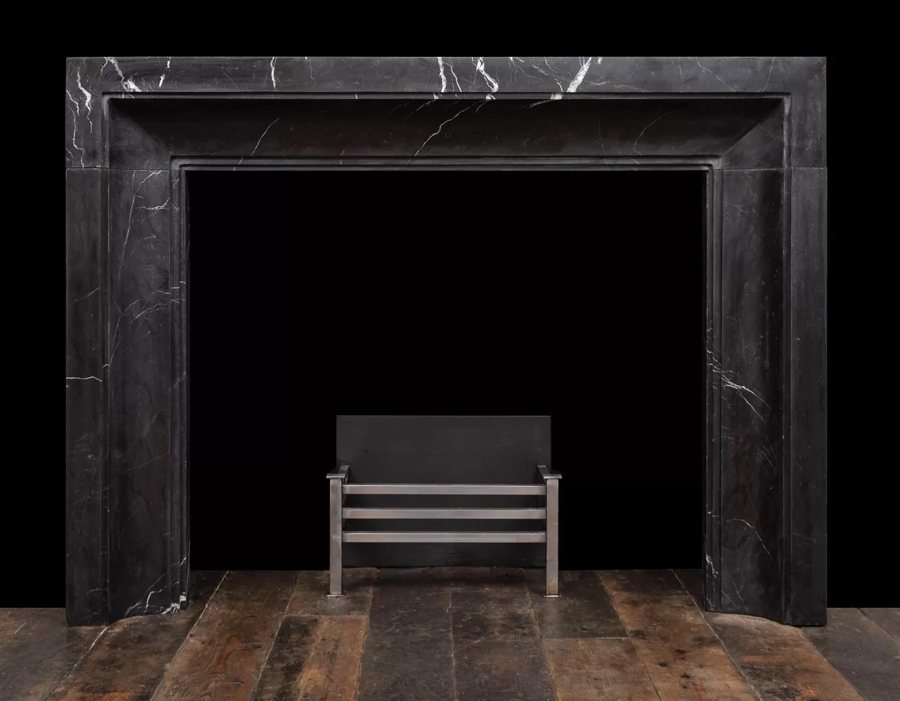 Hand-Crafted Art Deco inspired fireplace made in black and white Nero Marquina marble For Sale