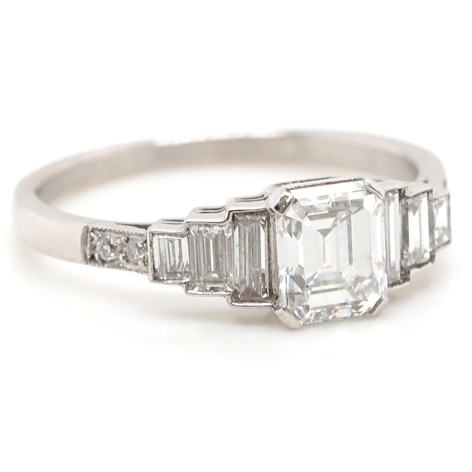 The ring is so well designed that it's a treat to just ogle. The GIA certified 1.02 carat emerald cut diamond is perfectly proportioned and the brightness of the E color radiates a cool ambiance. The accenting diamonds create a geometric symmetry.