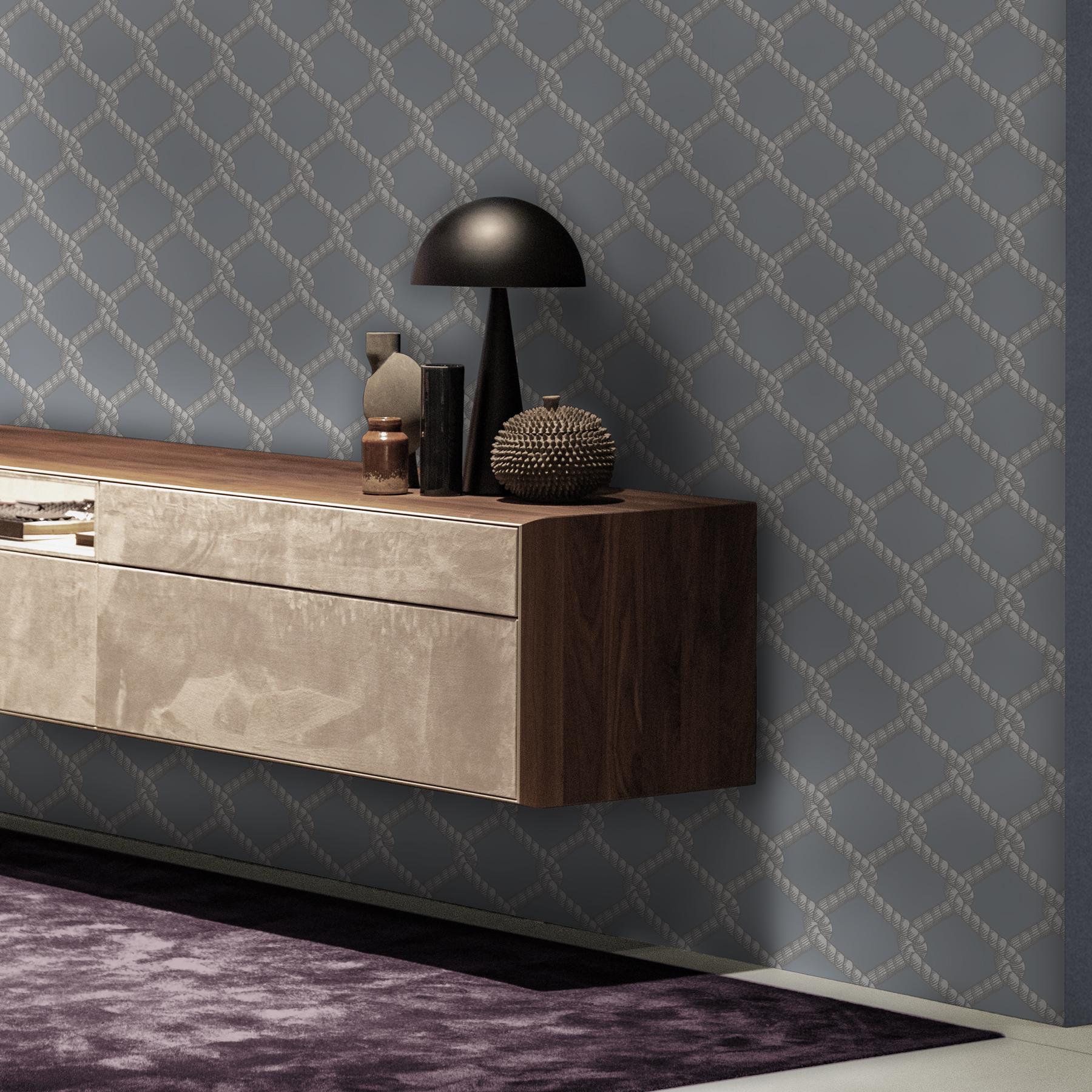MINIMUM ORDER 4 ROLLS FOR A TOTAL OF 44 YARDS.

This design is based on the detail from a 19th century European etching. Isolating and reworking the rope element in the original etching we have reinterpreted the motif of a trellis or net in a modern