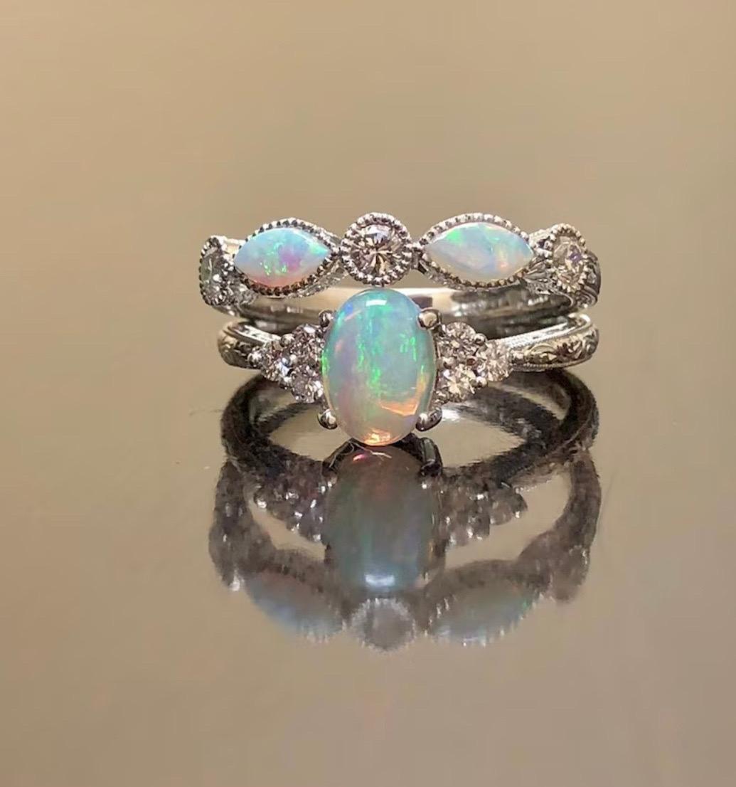 DeKara Designs Collection

Our latest design! An elegant and lustrous Opal cabochon and diamond hand engraved platinum engagement ring.

Metal- 90% Platinum, 10% Iridium.

Stones- Engagement Ring Oval Opal 8 x 6 MM, 6 Round Diamonds F-G Color VS1