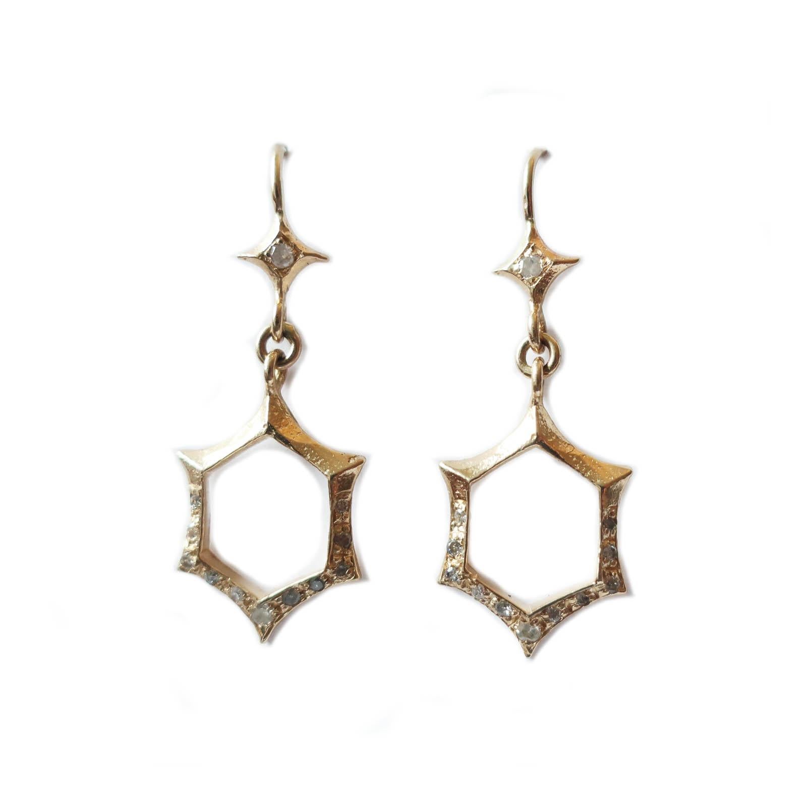 Gorgeous hand crafted solid 14K gold earrings with diamonds. These feature a star with a 2mm bead set icy diamond and 14k gold ear hook on the top. The bottom hexagon shape features 1mm pave diamonds. These are lightweight art deco inspired