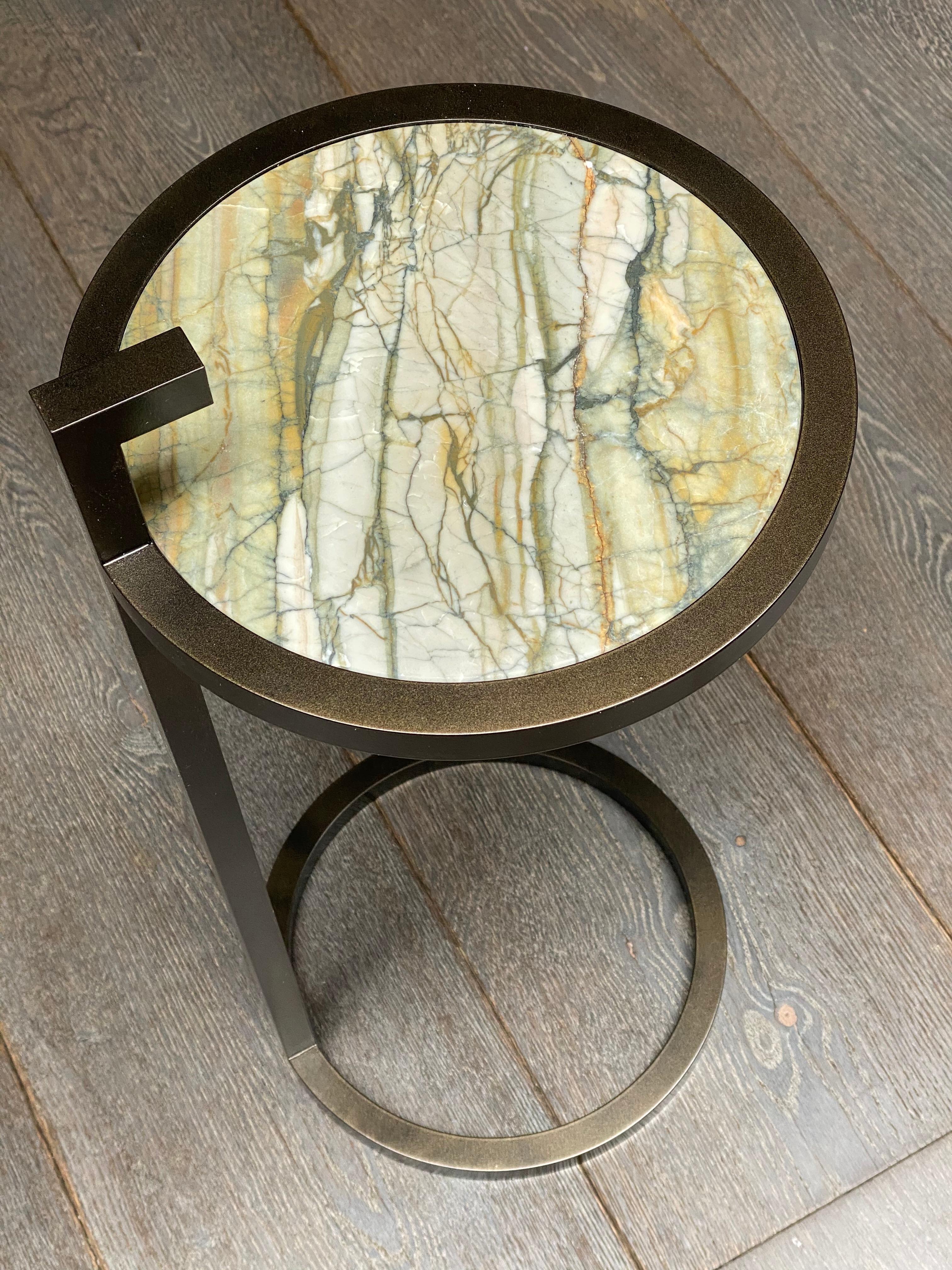 The Kangaroo Table with its marble surfaces captures the classic essence of the well-known 