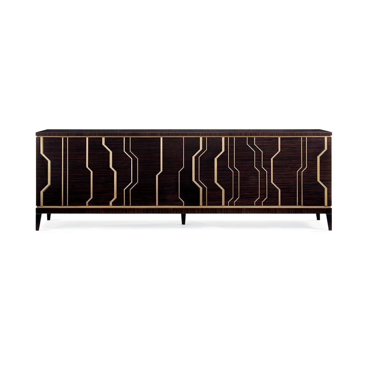 Art Deco Inspired Long Credenza, designed like a sculpture with a connoisseur’s selection of materials—a fashionable Ebony Macassar and French Brass—are precision-cut and masterfully arranged in an imaginative arrangement across its four integrated