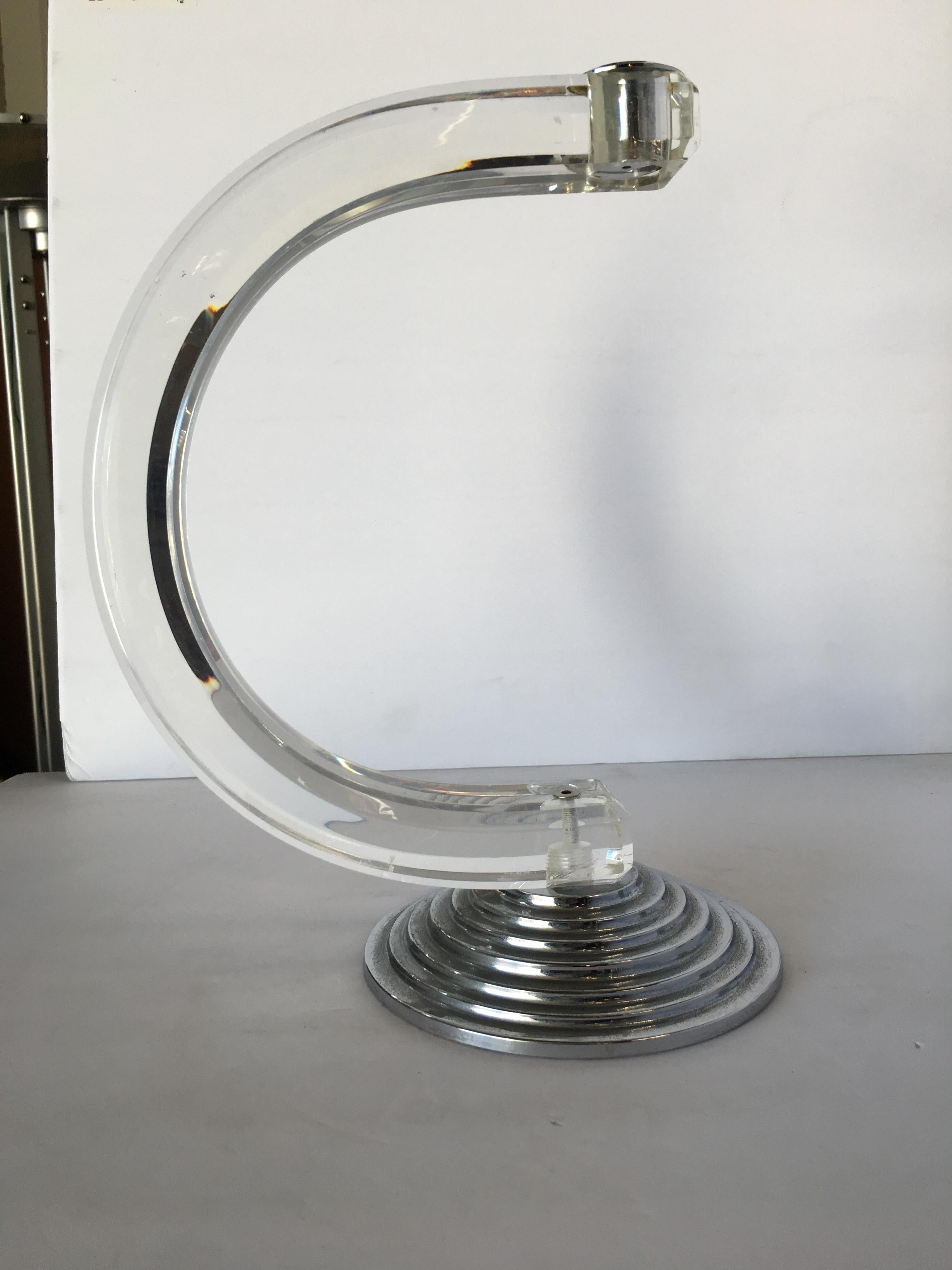 Art Deco inspired candlestick holder with a shaped piece of Lucite fixed to stepped Art Deco base.