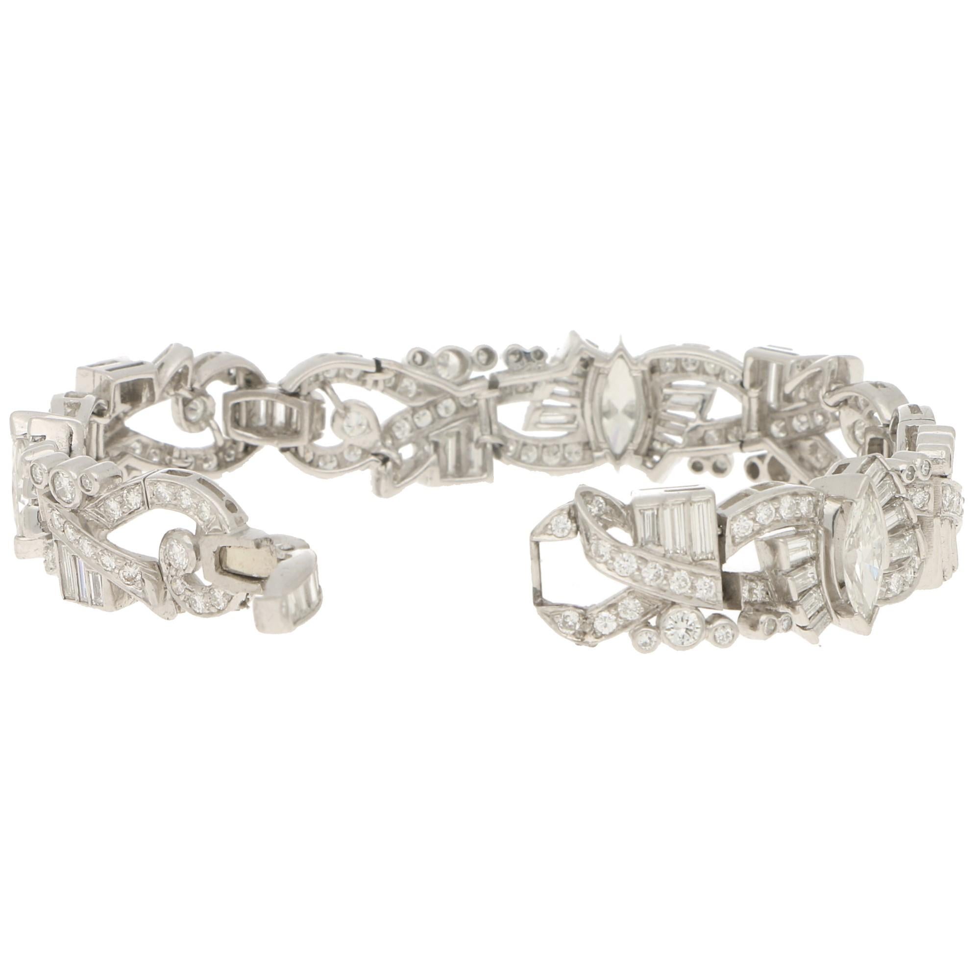 A beautiful Art Deco inspired marquise plaque bracelet set in 18k white gold. 

This beautiful piece is grain and rubover set throughout with round brilliant and baguette cut diamonds and has three large marquise shaped diamonds, one each in the