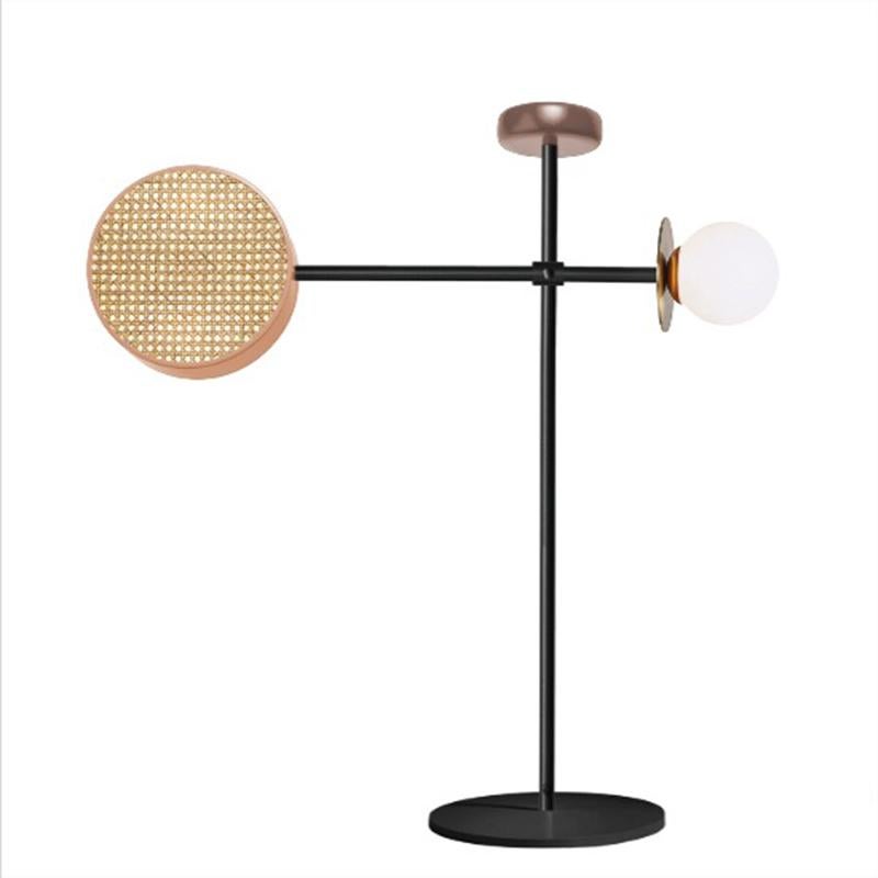Monaco Floor, with its articulate arm that can be adjusted at different positions, is a mobile-like creation that mix a handful of materials we love: rattan mesh, wooden detail and brass details intertwined with delicate and opal glass globes, in a