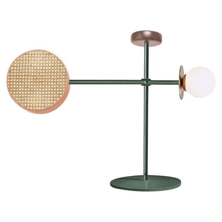 Monaco table is a mobile-like creation that mix a handful of materials we love: rattan mesh, wooden detail and brass details intertwined with delicate and opal glass globes, in a creative Art Deco inspired shape.
The structure and the cylinders are