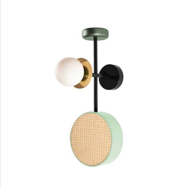 Monaco wall Sconce is a perfect balance of round shapes, rattan mesh, wooden detail and brass details intertwined with delicate and Frosted Glass Globes.
The structure and the metallic cylinder are finished in a smooth, homogeneous powder coating
