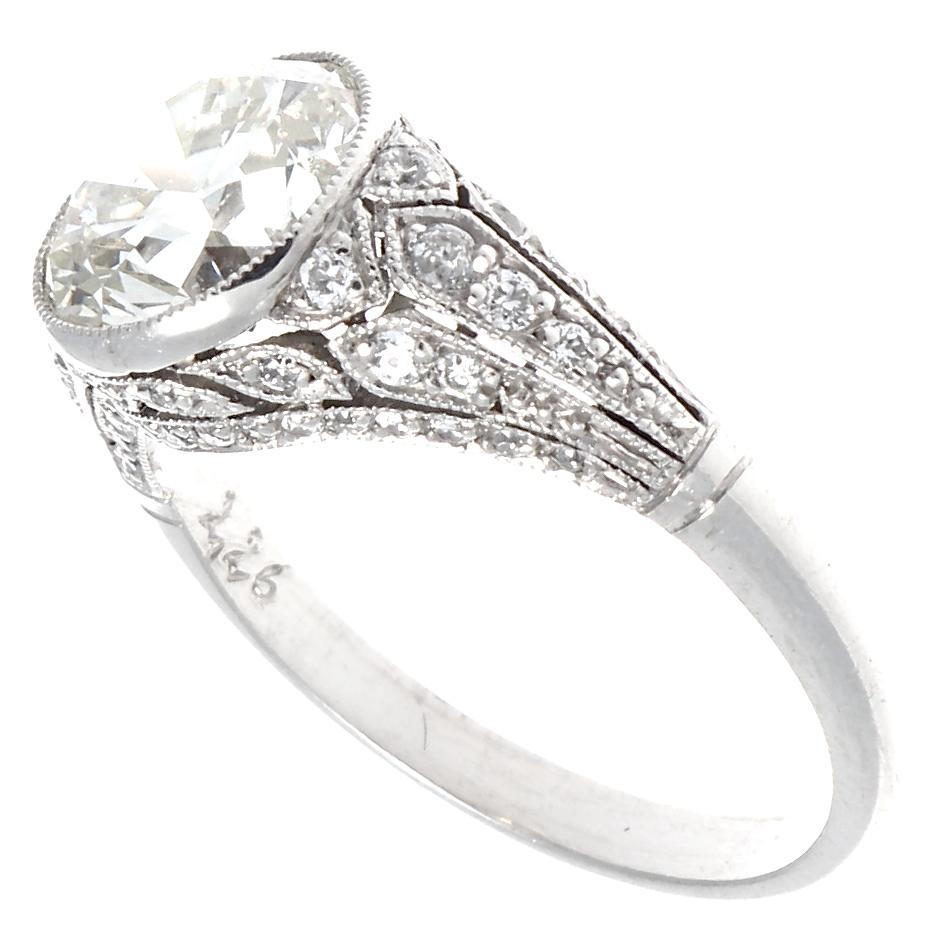 This natural 2.26 carat old European cut brings sparkle to a new level with its warmth and clarity. Graded K-L color and VS+ clarity, you'll feel the love in your heart every time you see its twinkling beauty. Adorned with 52 old European cut