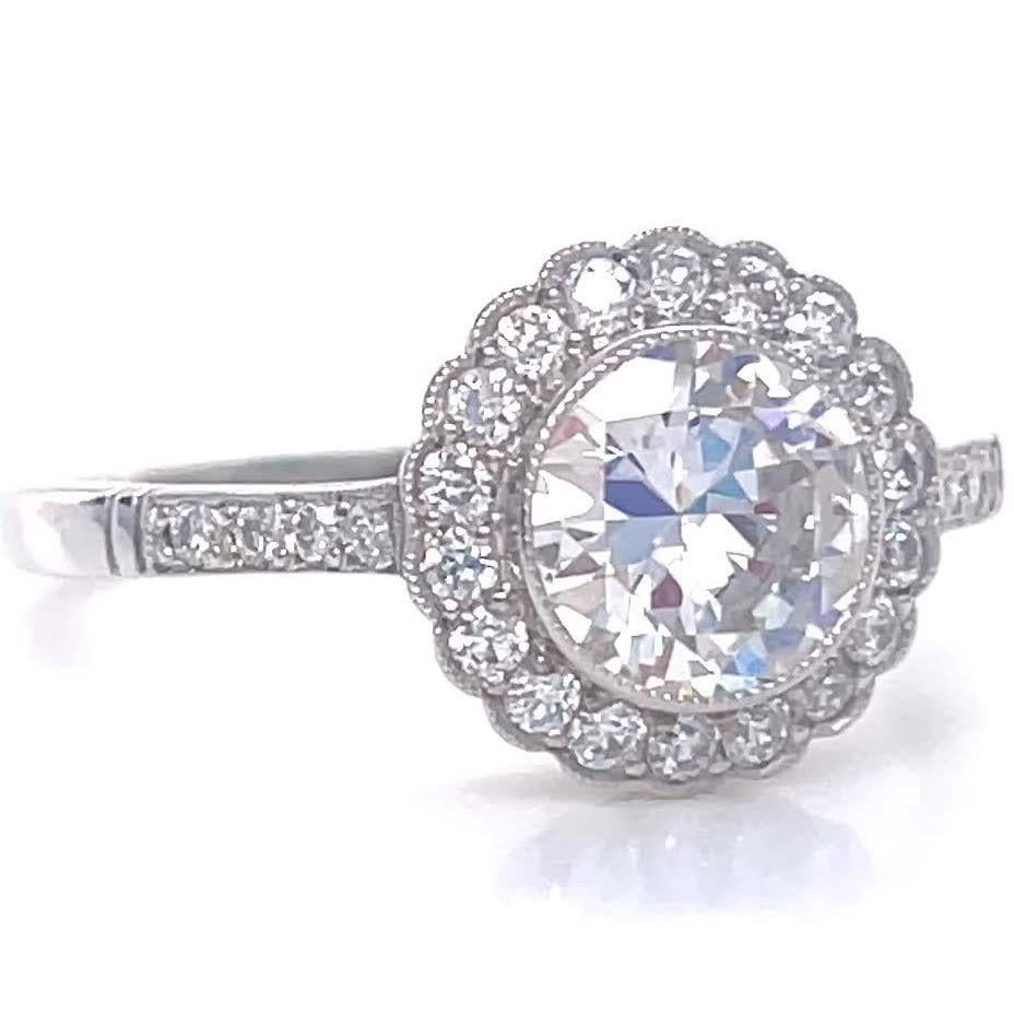 Looking for something unique? Consider this stunning Art Deco inspired engagement ring. Featuring a 0.90 carat old European cut diamond approximately I color, VVS clarity. Also 26 accenting old European cut diamonds, G-H color, VS clarity. Ring size