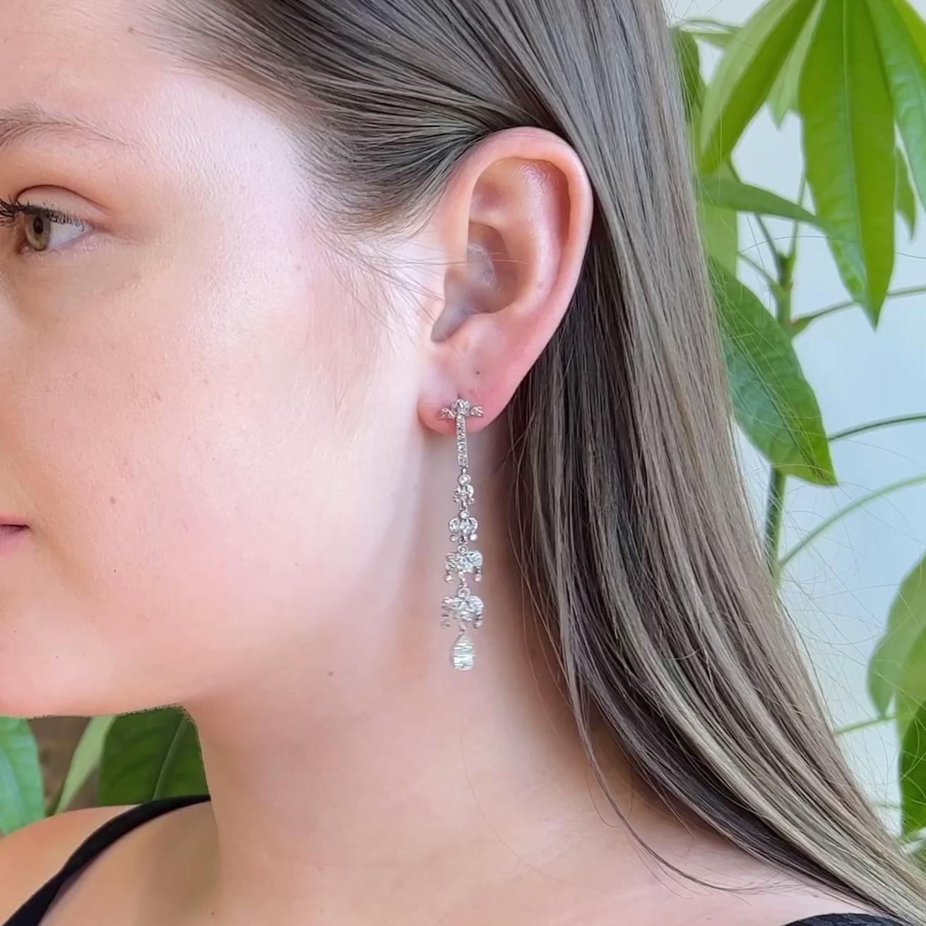 One Pair of Art Deco Inspired Old Mine Cut Diamond Platinum Chandelier Dangle Earrings. Featuring two old mine cut diamonds with a total weight of approximately 0.60 carat, graded G color, VS clarity. Accented by 140 old cut diamonds with a total