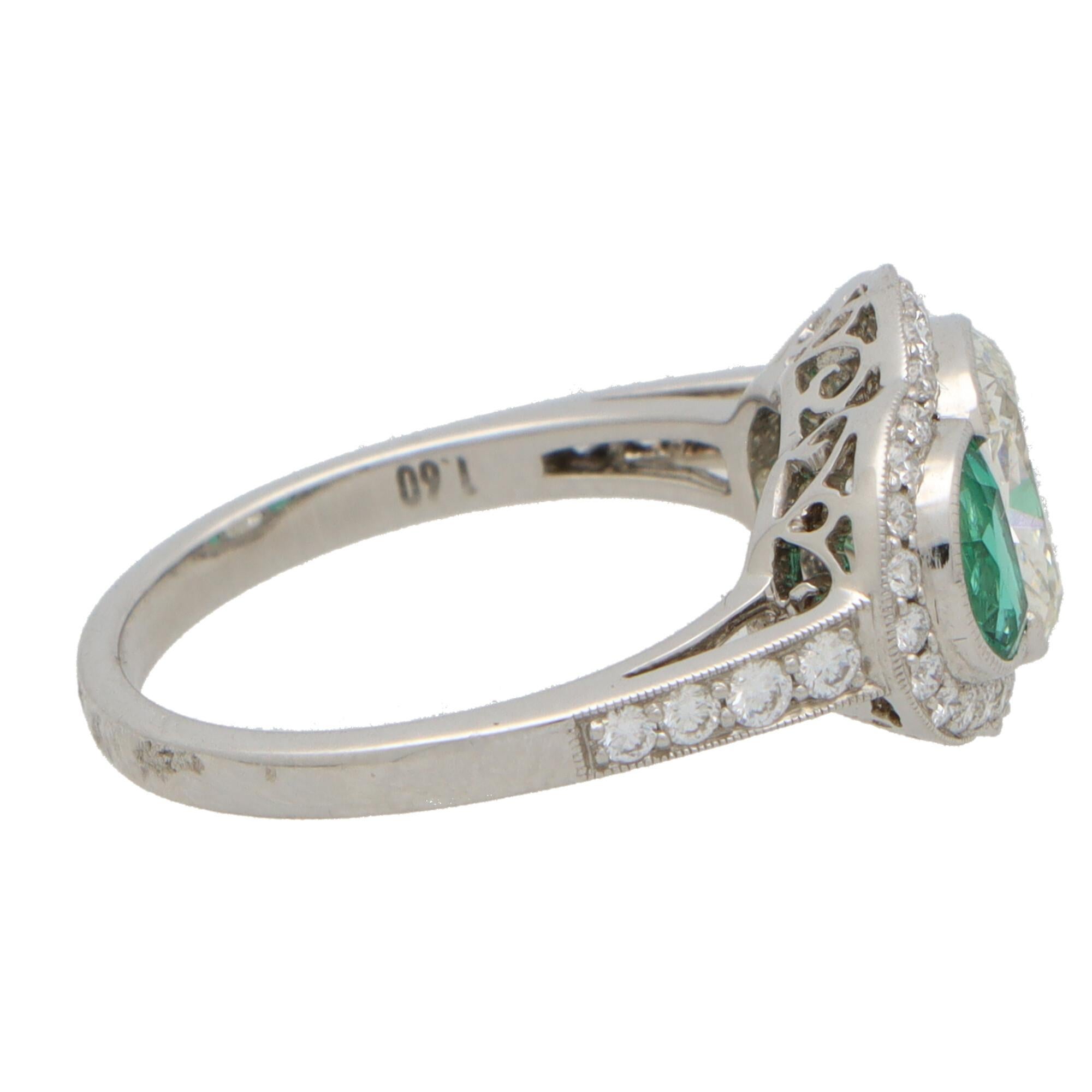 Oval Cut Art Deco Inspired Oval Diamond and Emerald Haloed Three Stone Ring in Platinum For Sale