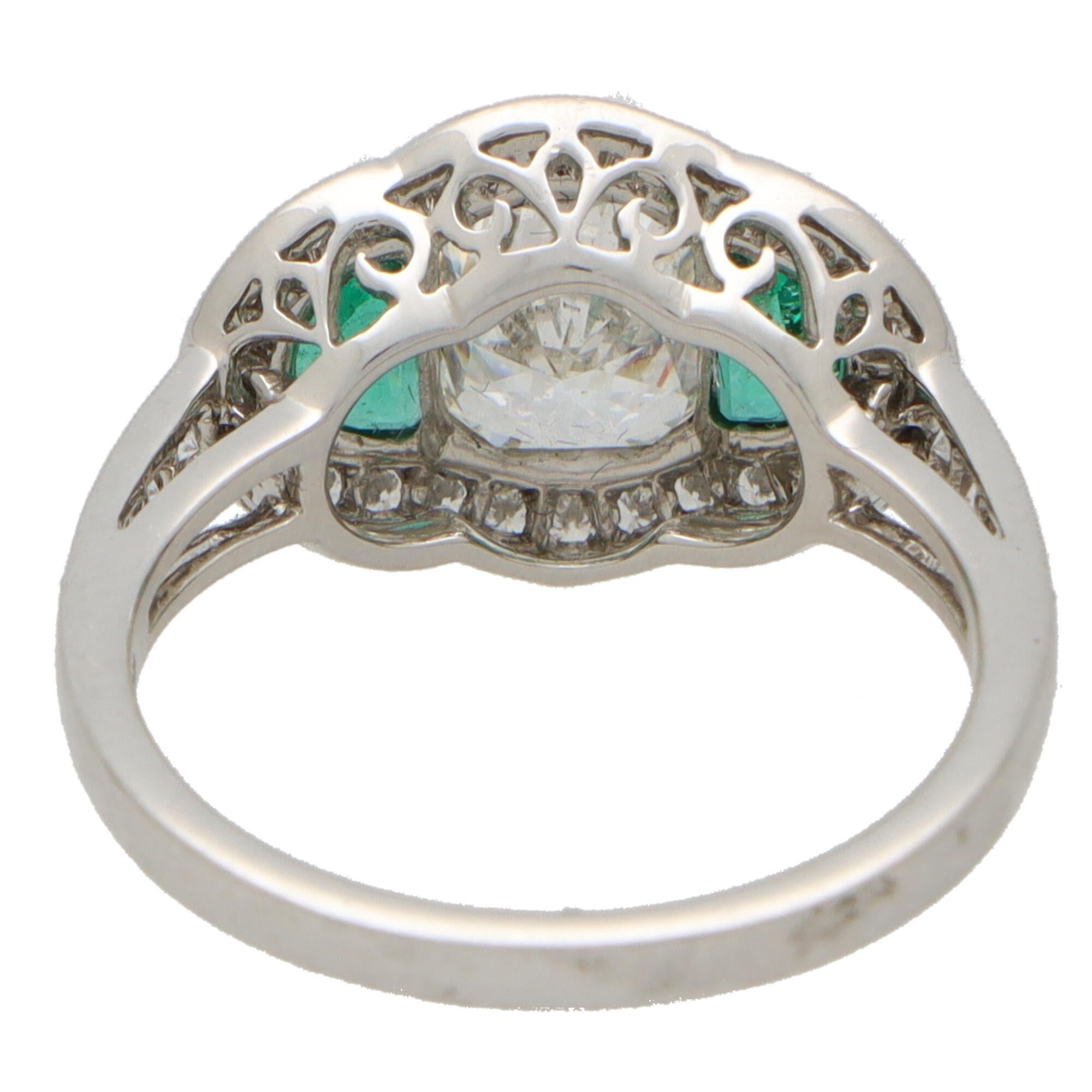 Art Deco Inspired Oval Diamond and Emerald Haloed Three Stone Ring in Platinum In Excellent Condition For Sale In London, GB