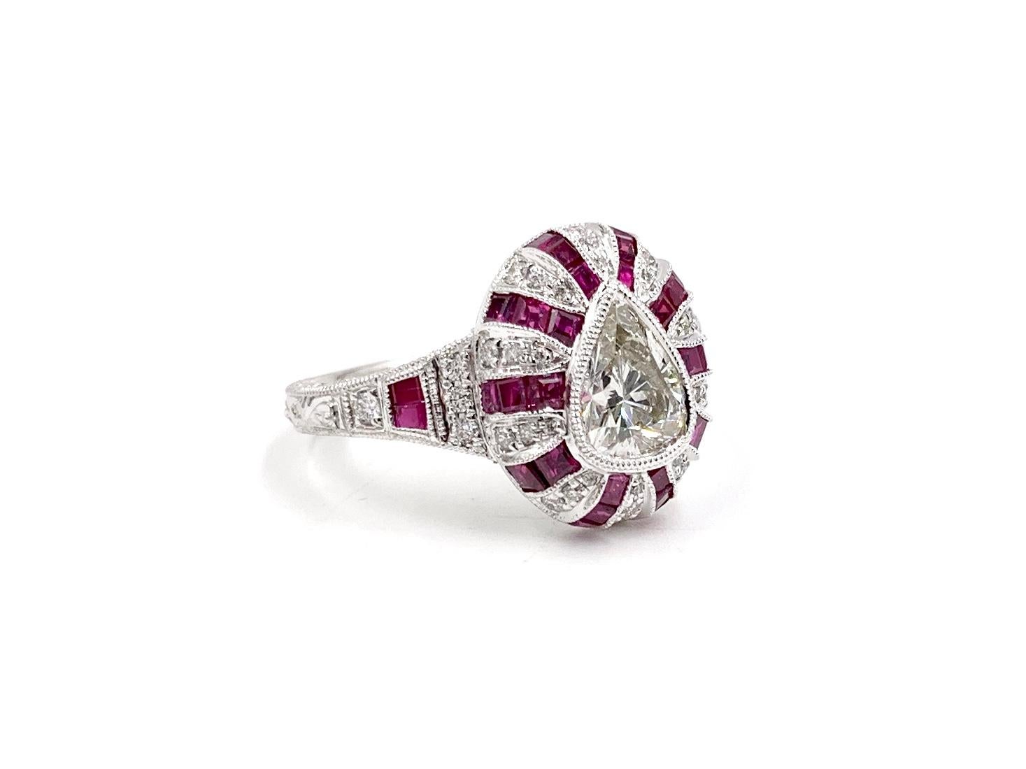 A gorgeous Art Deco inspired 14 karat white gold ring featuring a .87 carat center pear shape diamond with quality of approximately H color, VS2 clarity perfectly bezel set. Diamond is surrounded by alternating rows of princess cut rubies at 1.30