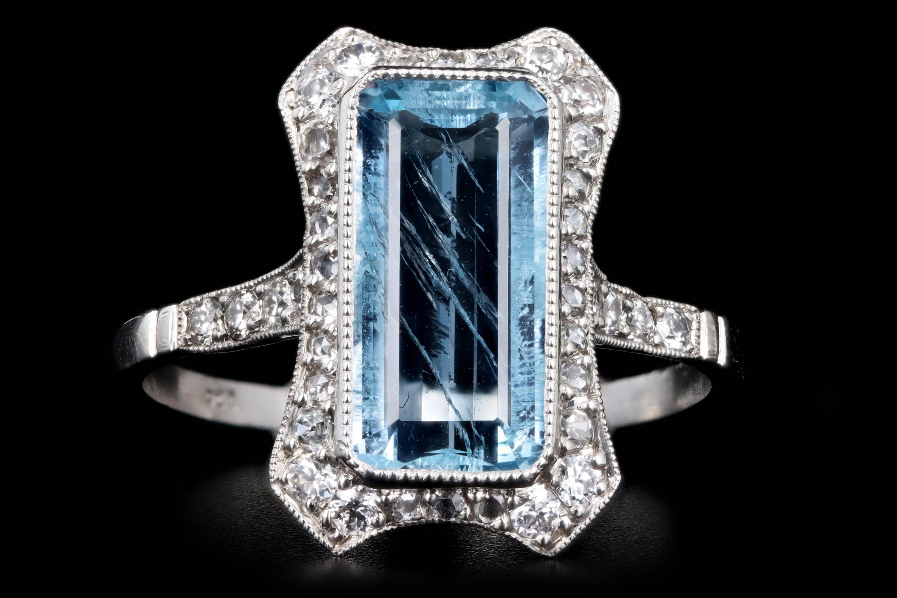 Era: Art Deco Inspired

Composition: Platinum

Primary Stone: Aquamarine

Carat Weight: Approximately 2.18 Carats

Accent Stone: Thirty Eight Old European Cut Diamonds

Carat Weight: Approximately .25 Carats in Total

Color/Clarity: G-H /