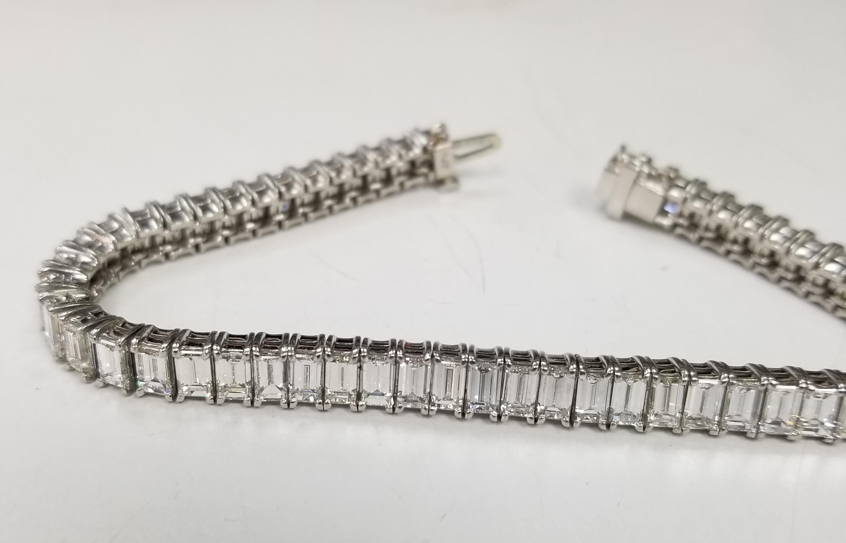 A magnificent Art Deco inspired seamless baguette cut diamond line bracelet set in platinum. 

This stunning bracelet is composed of exactly 55 baguette cut diamonds all of which are prong set for the most visible show of diamonds. Due to the design