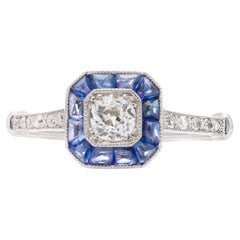 Art Deco inspired platinum diamond and sapphire cluster ring.  