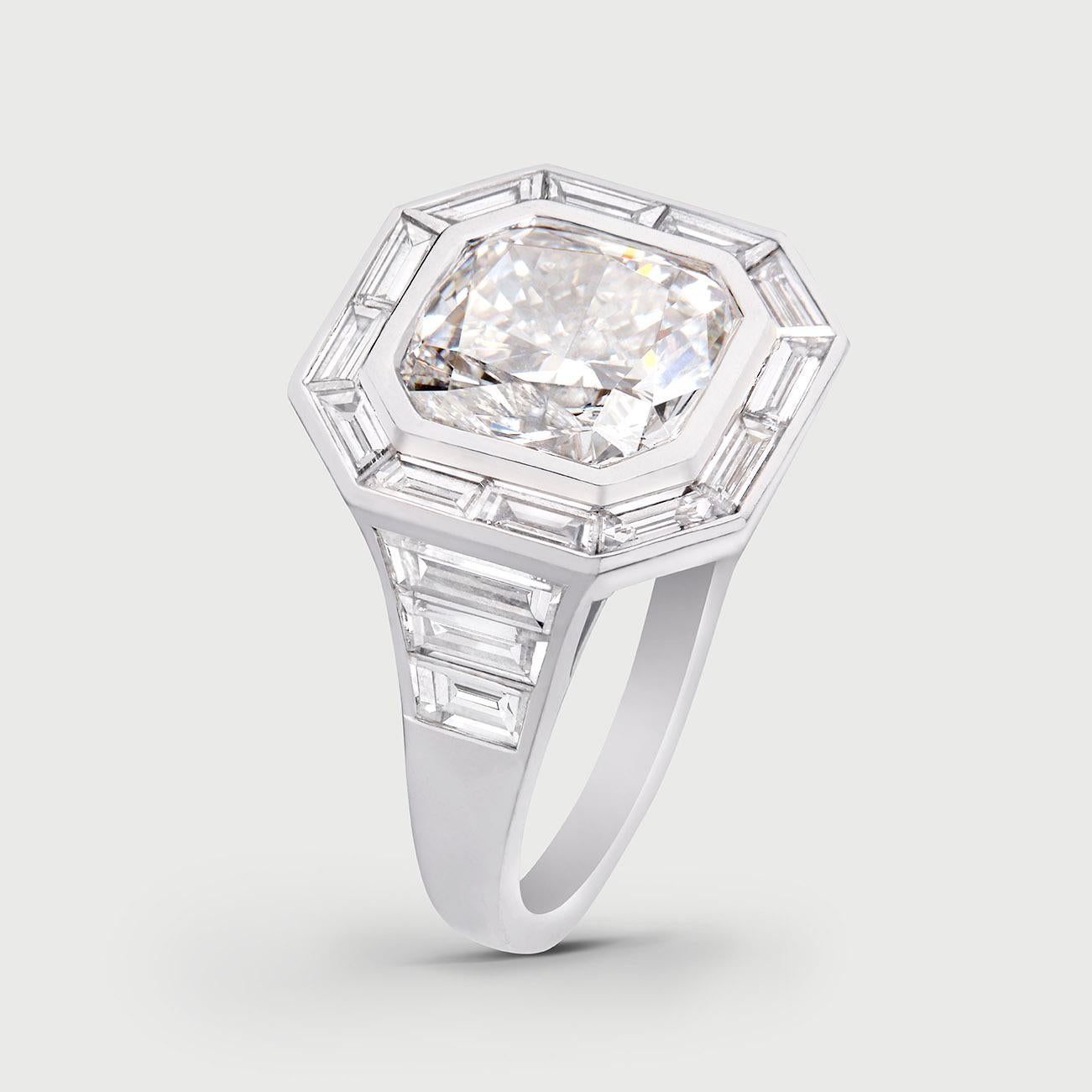 Art Deco inspired ring crafted in 18K White Gold

Carat total weight (Cushion Cut centre stone): 3 ct.
Carat total weight (Diamond Side baguettes): 2 ct.
Carat total weight: 5 ct.
GIA Certified: G / Si1

Handcrafted in Italy. 

Can be worn as an