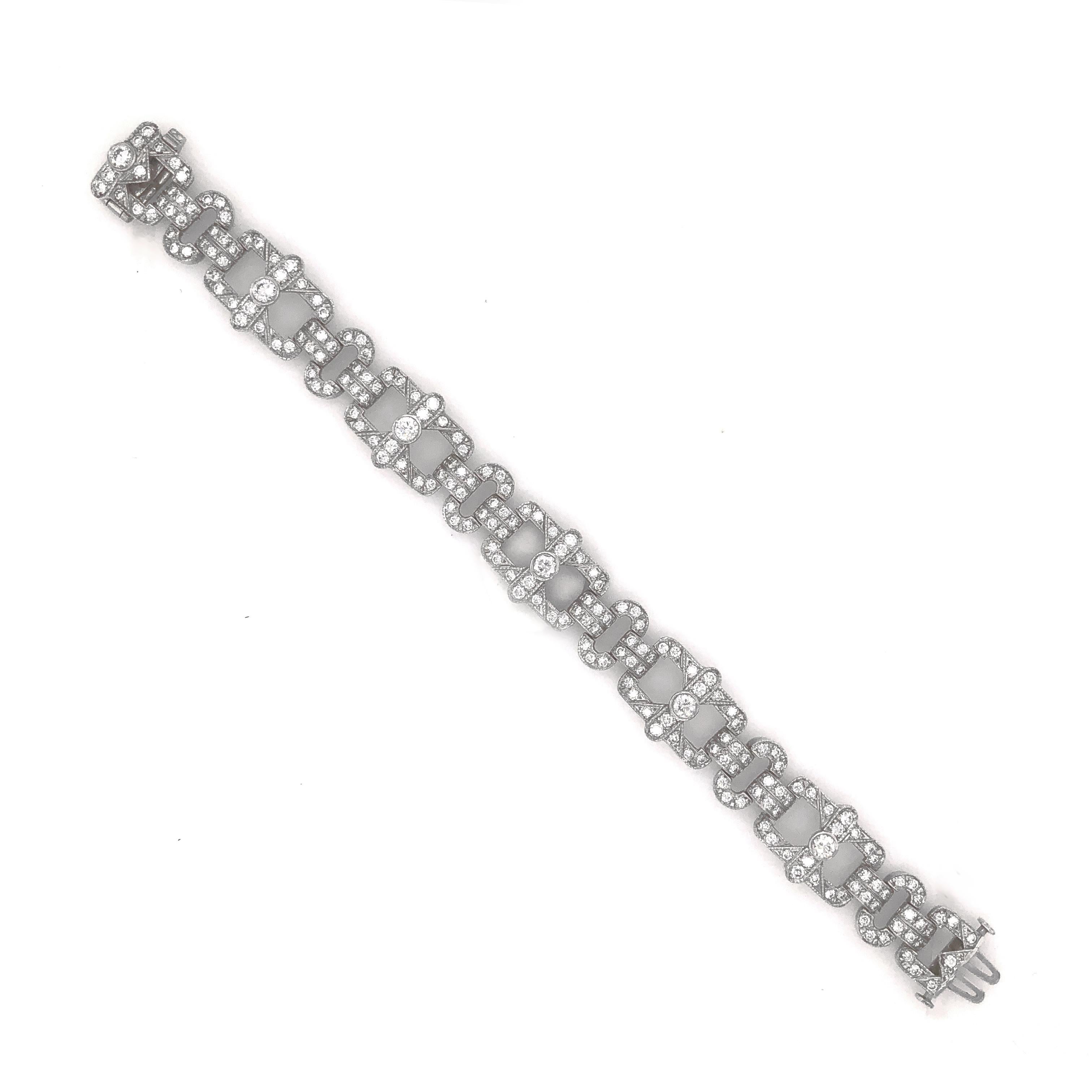 This is a slim vintage and Art Deco inspired diamond platinum bracelet.  It is adorned with white round cut diamonds in 6.18 carat total  Diamonds are all natural in G-H Color Clarity VS.   Platinum 950 bracelet. 
