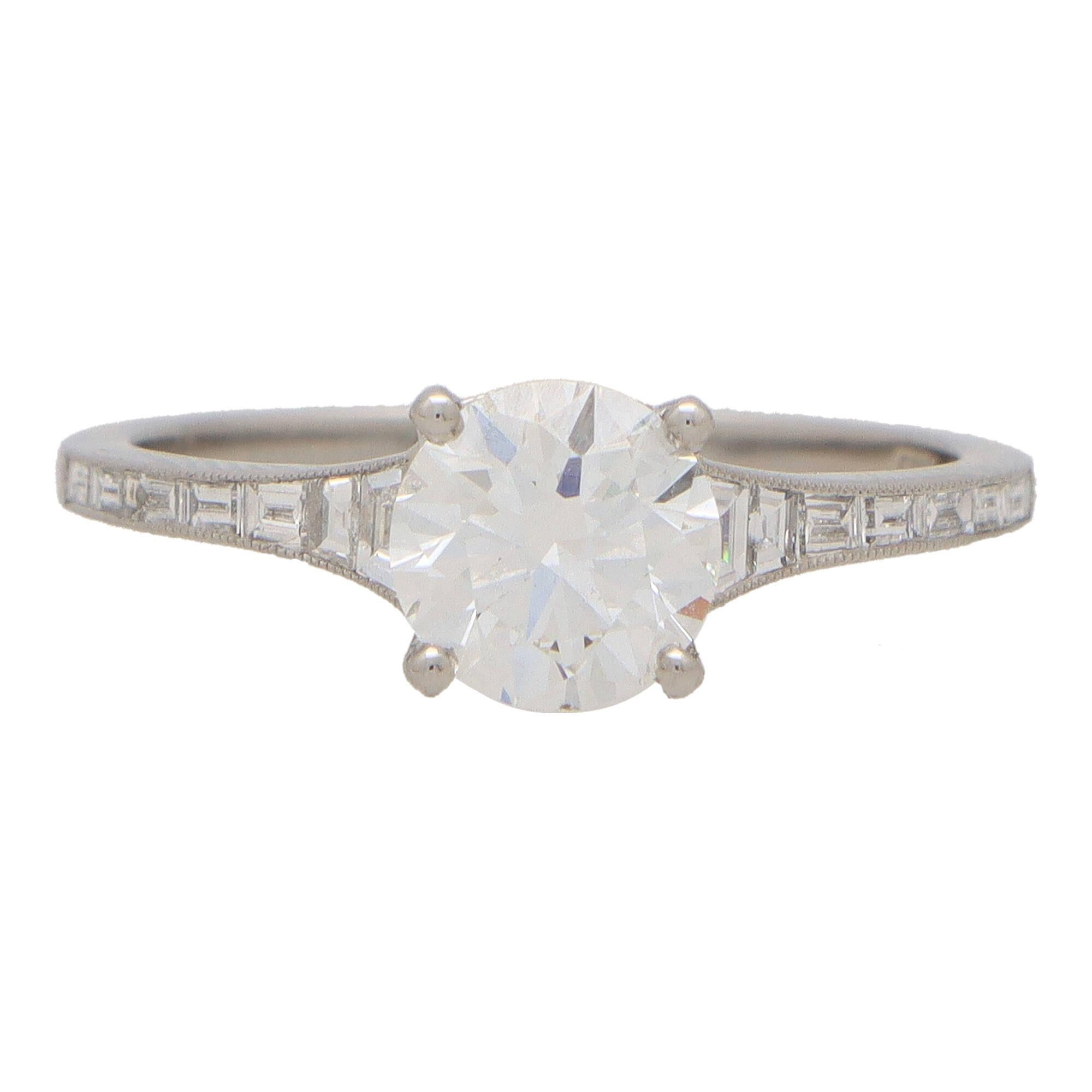 A beautiful Art Deco inspired round brilliant cut diamond ring set in platinum.

This sparkly piece is centrally set with an extremely elegant independently GIA certified round brilliant cut diamond. The diamond is securely four claw set to centre