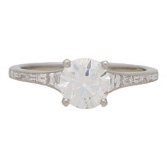 Art Deco Inspired Round Diamond Ring with Baguette Shoulders Set in Platinum