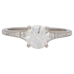 Art Deco Inspired Round Diamond Ring with Baguette Shoulders Set in Platinum
