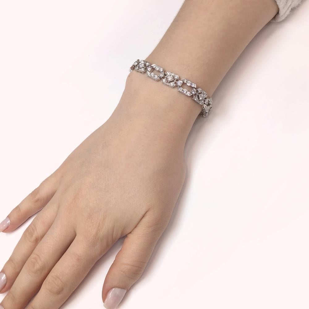 A very feminine, slim and elegant art deco inspired platinum bracelet adorned with natural white diamonds 6.38 ct. Diamonds are natural and G-H Color Clarity VS.  SKU ER514.  