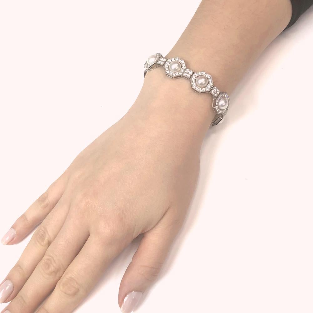 A classic and elegant platinum 950 bracelet adorned with white round fresh water pearls.
Each pearl is placed within an octagonal frame adorned by round natural white diamonds 6.35 ct.
Diamonds are white, natural and in G-H Color Clarity VS.   
The