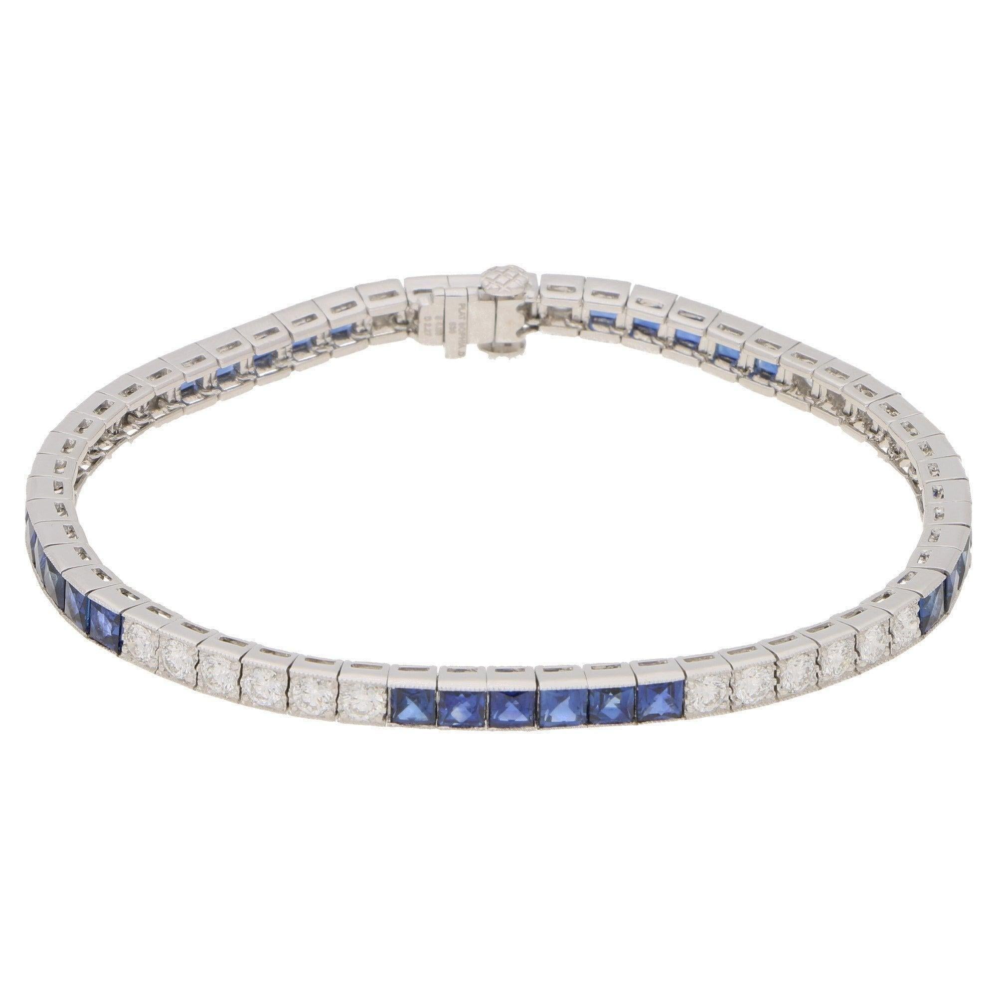 A beautiful Art Deco inspired sapphire and diamond line bracelet set in platinum. 

This stunning bracelet is composed of a perfectly balanced mixture of French cut sapphires and round brilliant cut diamonds; all of which are rub over set