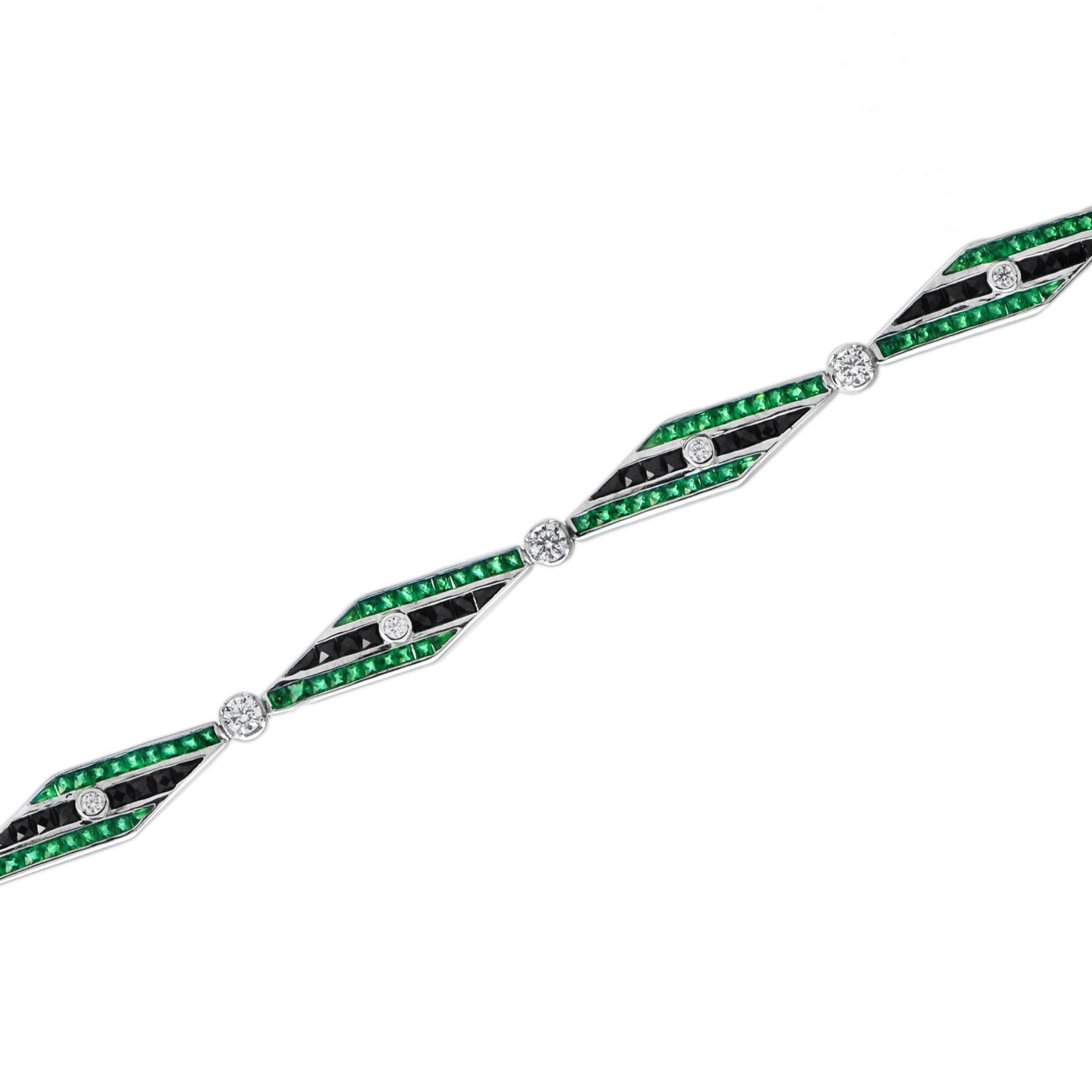 This Art Deo design bracelet is exceptional! It features links set with round diamonds, square-cut onyx, and emerald. This piece closes with a concealed clasp and safety catch. Given the outstanding quality and beautiful design of this Art Deco
