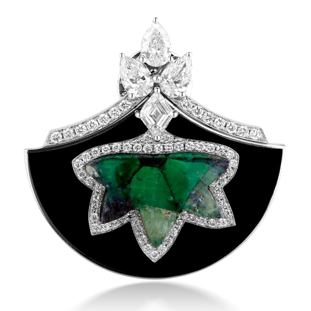 This Piece features a pair of Certified Trapiche Colombian Emeralds weighing 5.62ct + 5.74ct in a 