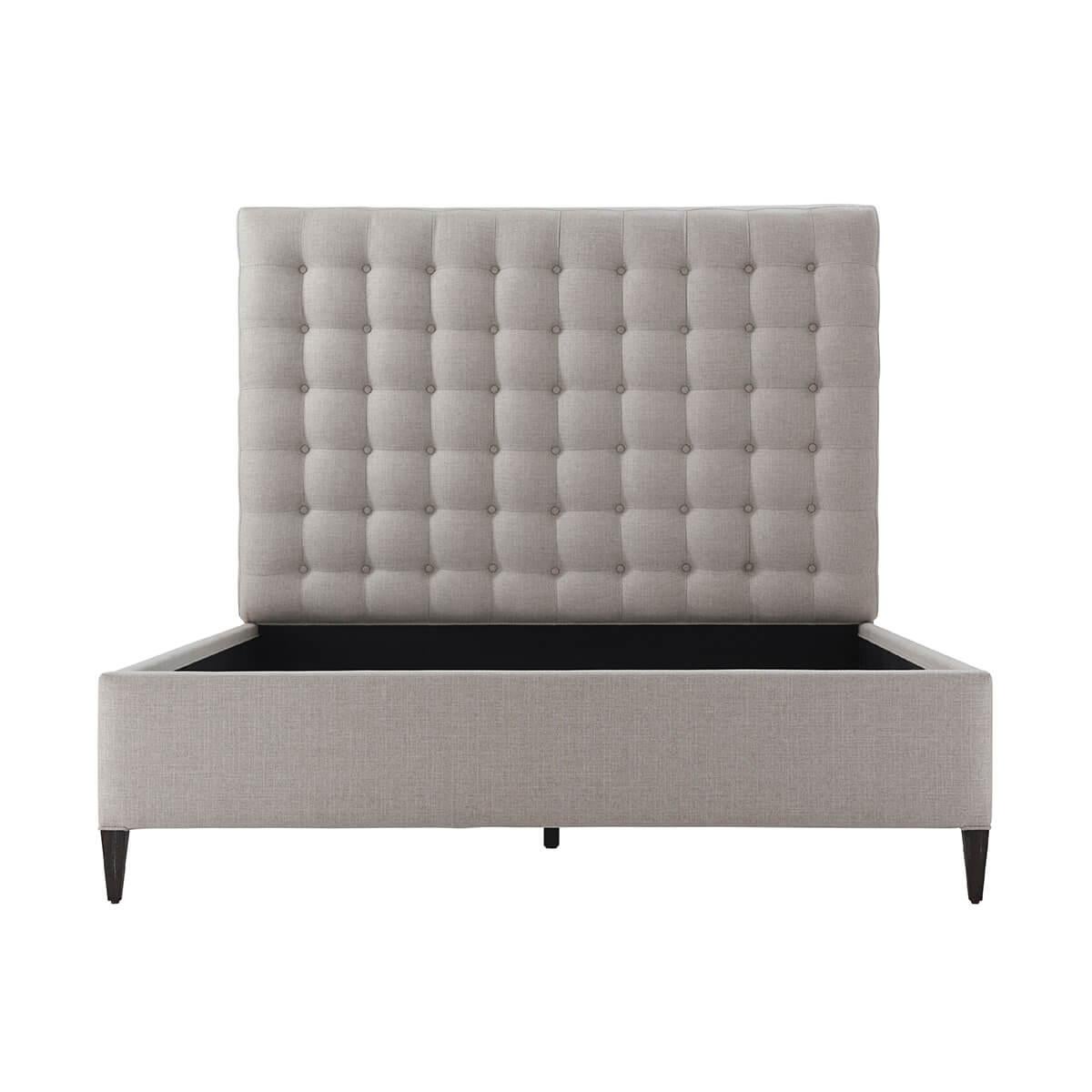 With a biscuit tufted headboard with upholstered rails and raised on square tapered legs.

Dimensions: 65