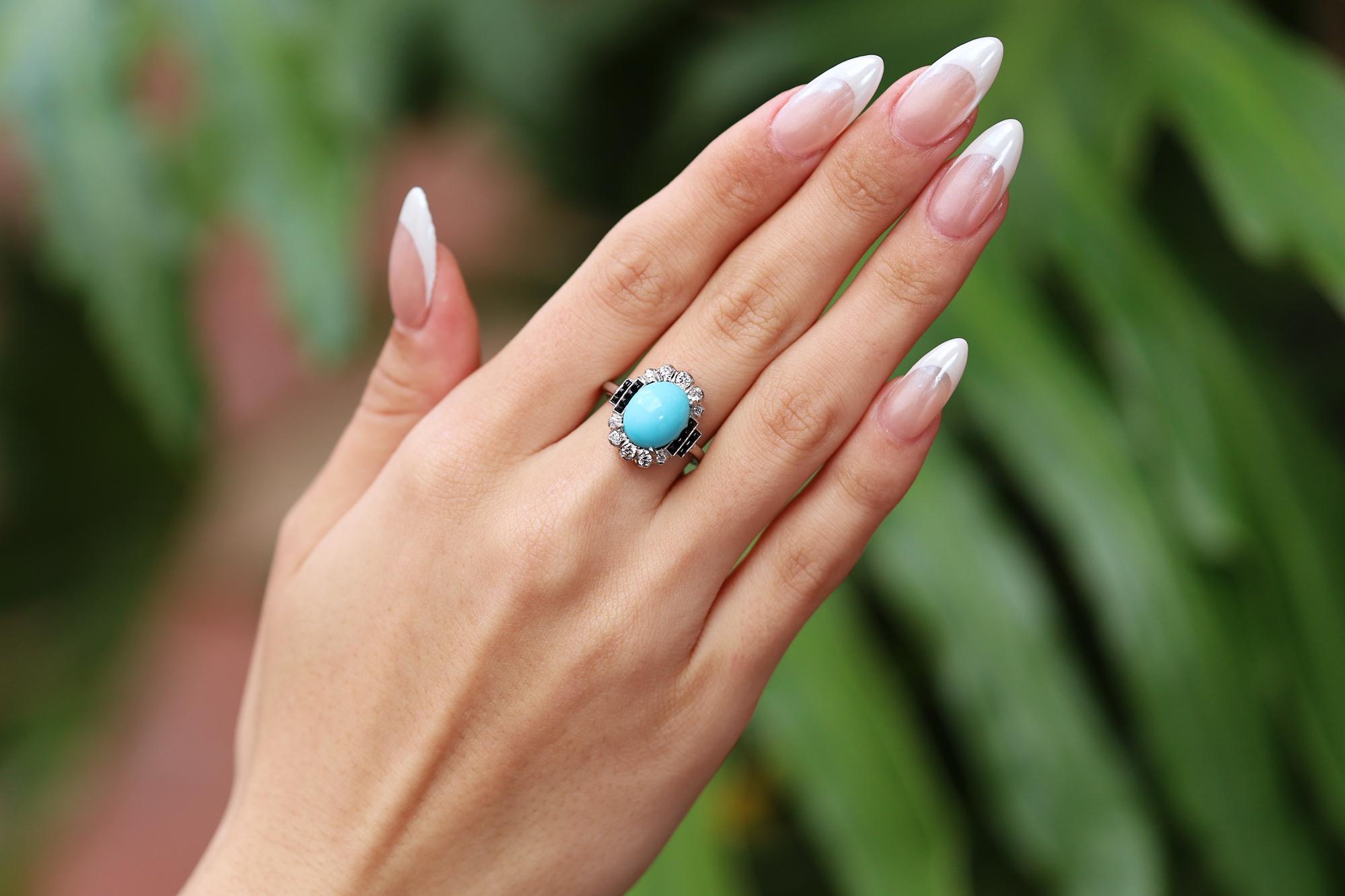 Our bespoke Art Deco style cocktail ring featuring a pure and beautiful robin's egg blue turquoise is simply sublime. The smooth and lustrous cabochon gemstone acquires a striking contrast with sleek, black onyx cabochons and diamond shoulders along