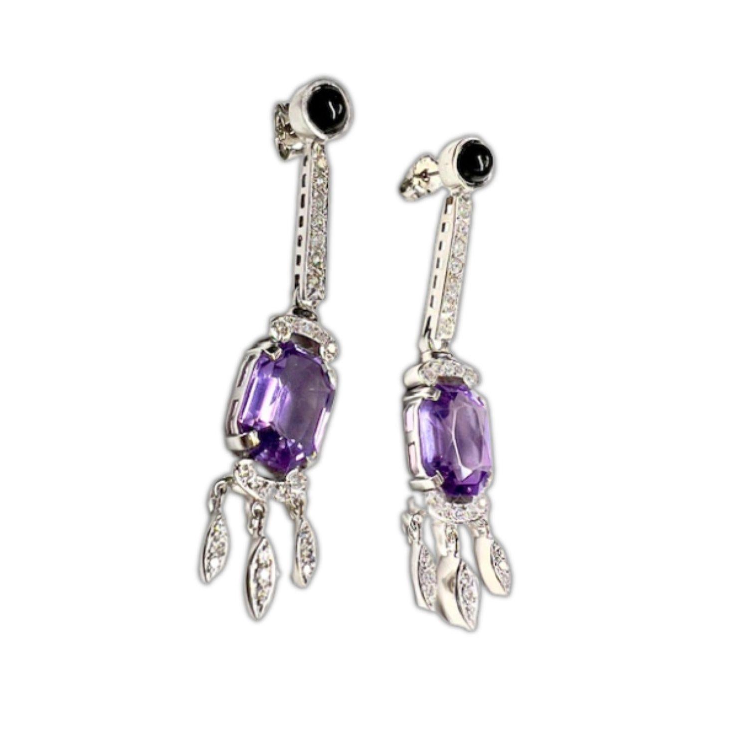 Indulge in the sophistication of the Art Deco era with these stunning white 18-karat gold earrings adorned with diamonds, onyx, and amethysts. A true fusion of luxury and vintage charm, these earrings exude an aura of timeless elegance.

The focal