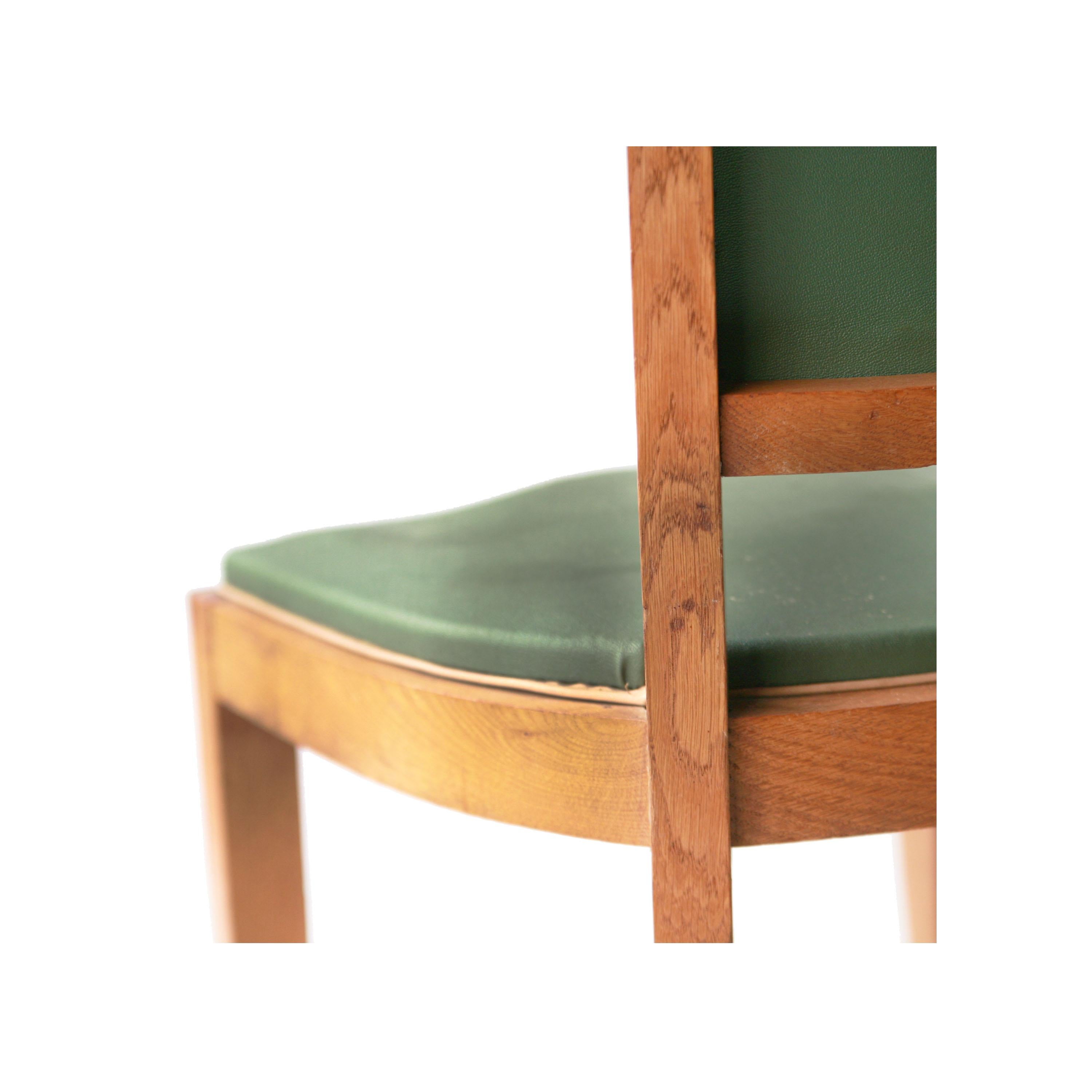 Set of six chairs with solid oak wood structure upholstered in original leatherette in green tone from the interwar period inspired by the Art Deco.