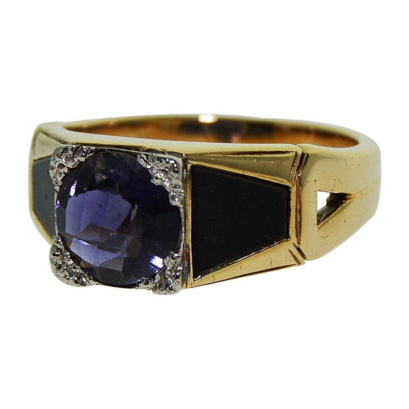 This 14K yellow gold Art Deco ring is centered by a round, checker cut, Fine Medium Blue Iolite approx. 1.30cts set in a white gold prong setting and flanked by two custom cut triangle shape black onyx totaling approx. 1.30cts. This striking and
