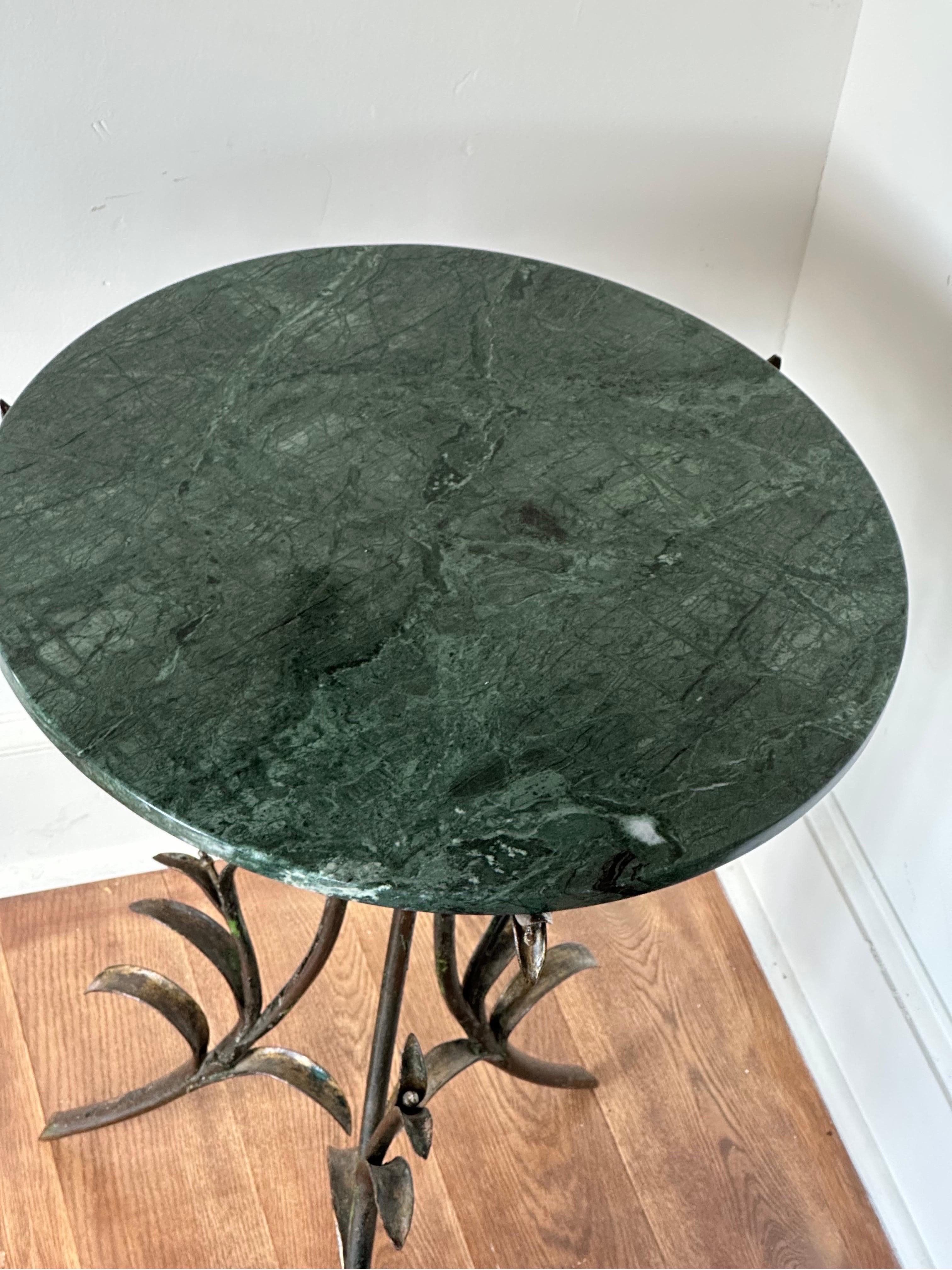 Art deco iron and marble top table with floral decoration  In Excellent Condition For Sale In Hudson, NY