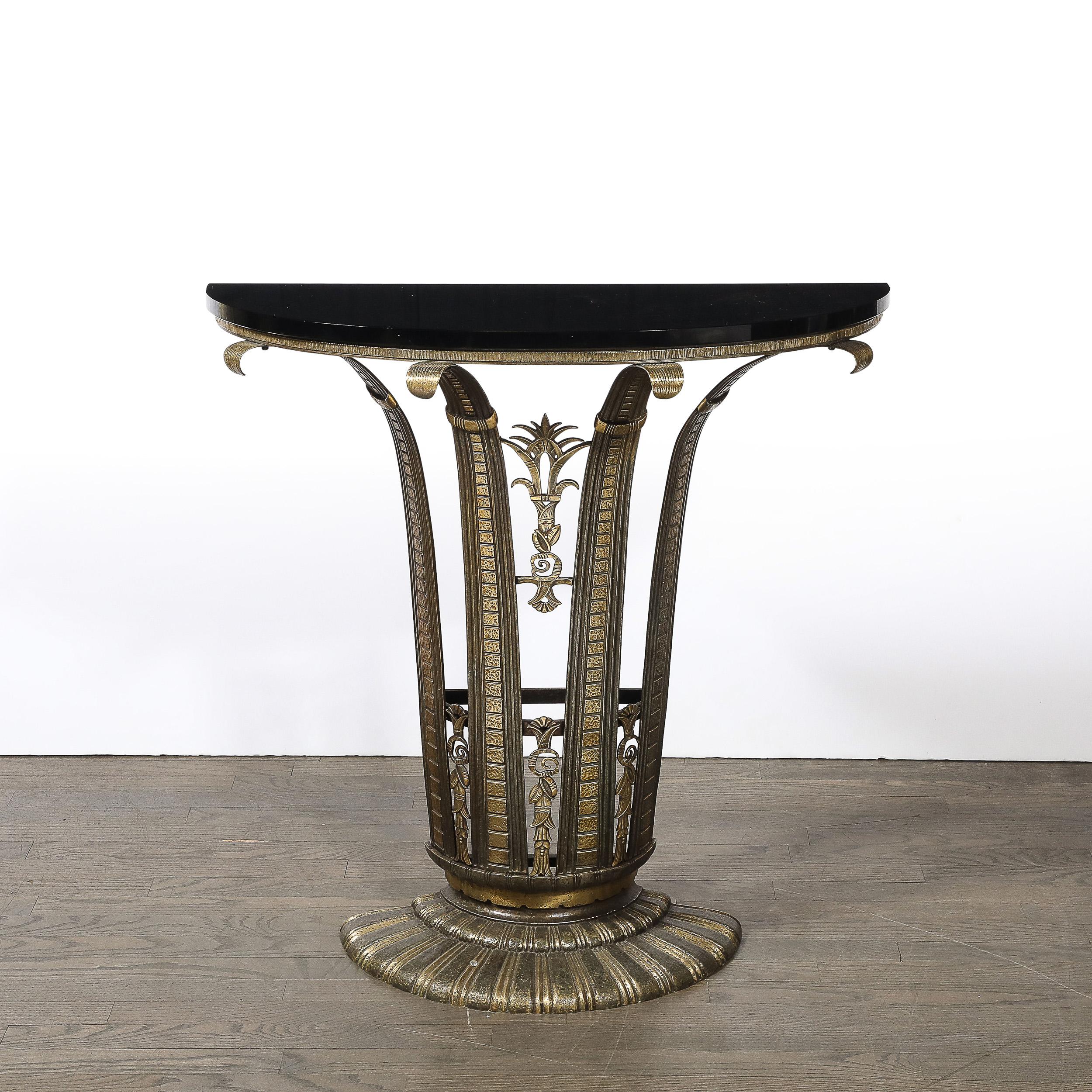 Crafted with unparalleled sophistication, this exquisite Art Deco iron console table was designed by the renowned French designer Marcel Bergue around 1925. Marcel Bergue was an eminent figure in the Art Deco movement, celebrated for his meticulous