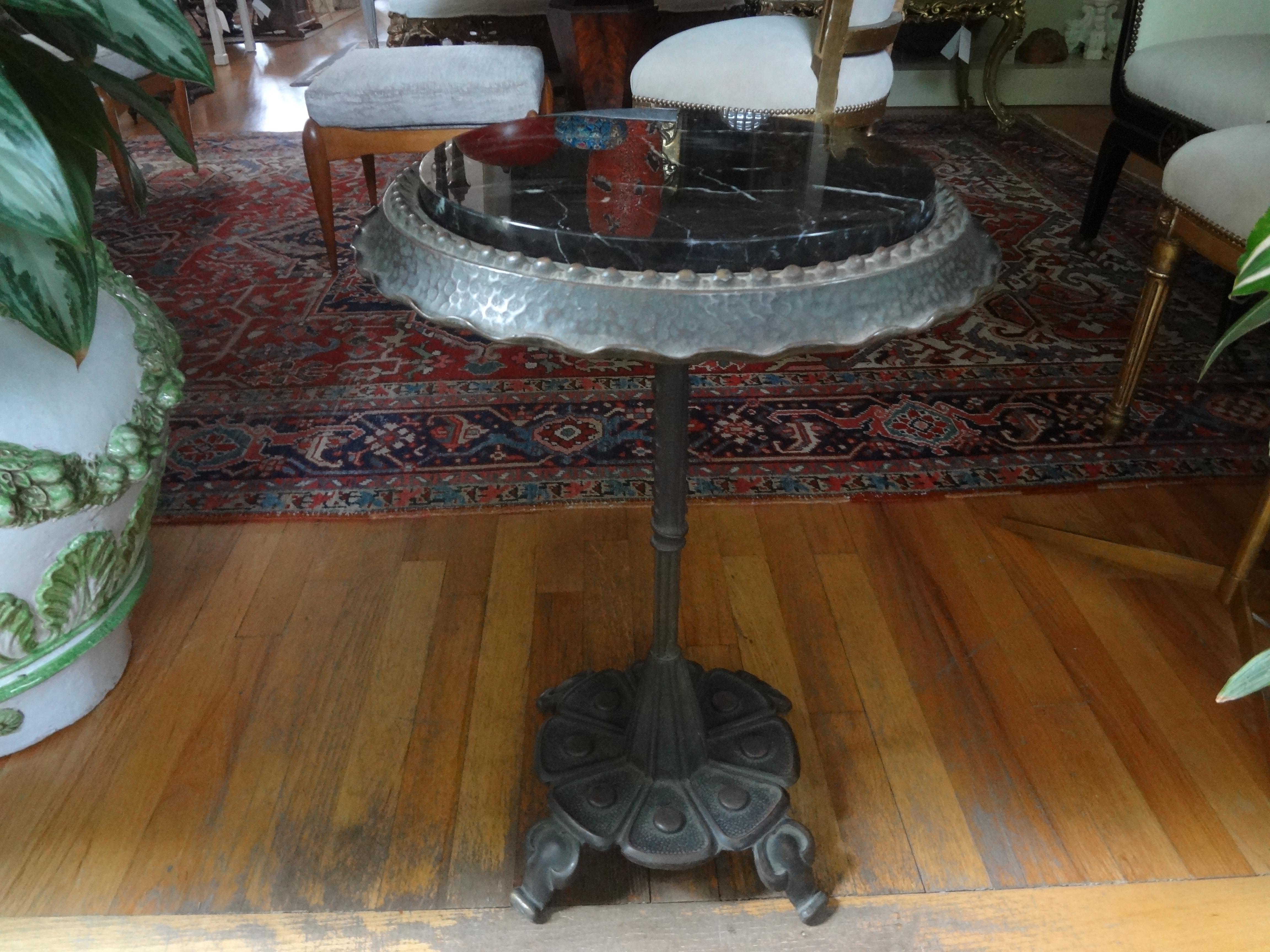 Fantastic stylized Art Deco iron table with a marble top. This stunning Edgar Brandt style Art Deco pedestal table is the perfect side table, drinks table, guéridon or cigarette table. Our table would work in a variety of interiors.