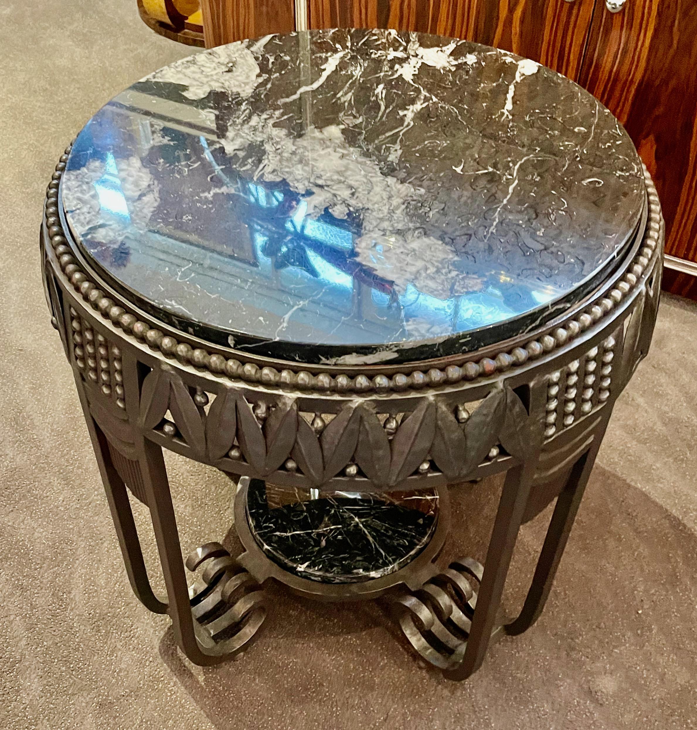 Art Deco iron table, custom made exclusively for Art Deco Collection in the original Fer Forge French tradition with a top made of richly veined black & white marble. The ironwork is a faithful rendition of the style made popular by the great French