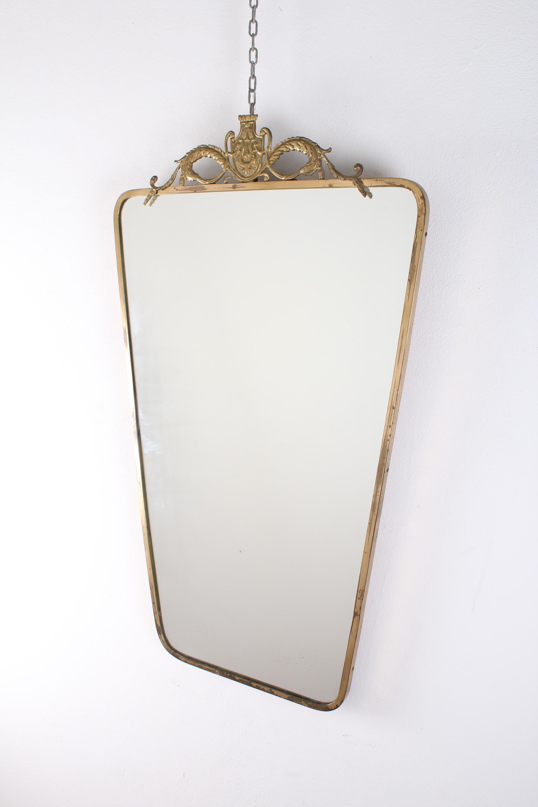 Art Deco Italian brass frame with a coat of arms. Wall mirror Pier Luigi Colli style.
Wear consistent with age and use.