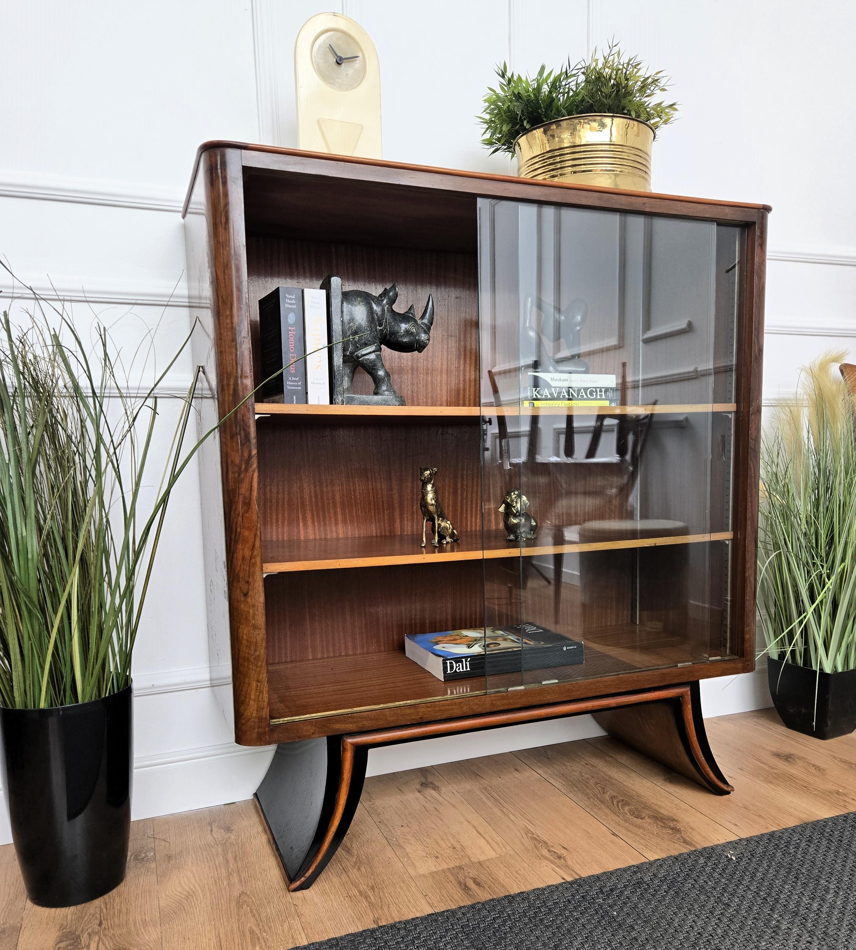 A beautiful Italian walnut, carved, three shelves sideboard cabinet with glass doors in typical Art Deco design shape, wood finish. This piece is ideal as open bookcase as well as cabinet sideboard credenza. The beautiful burl wood pattern decors