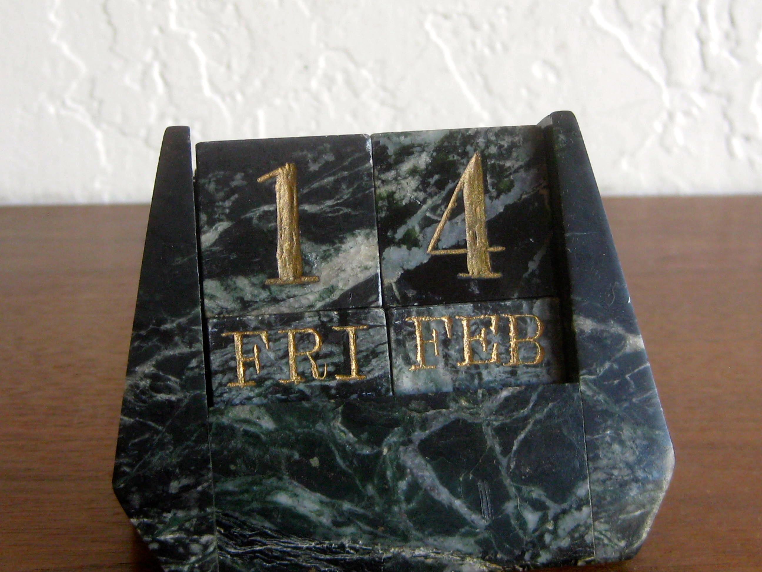 Outstanding Art Deco Italian green marble perpetual desk calendar. Carved out of natural green marble and features the day, date and month. Great color and form. In excellent shape with no cracks, no chips and no repairs. Measures: 3 1/2