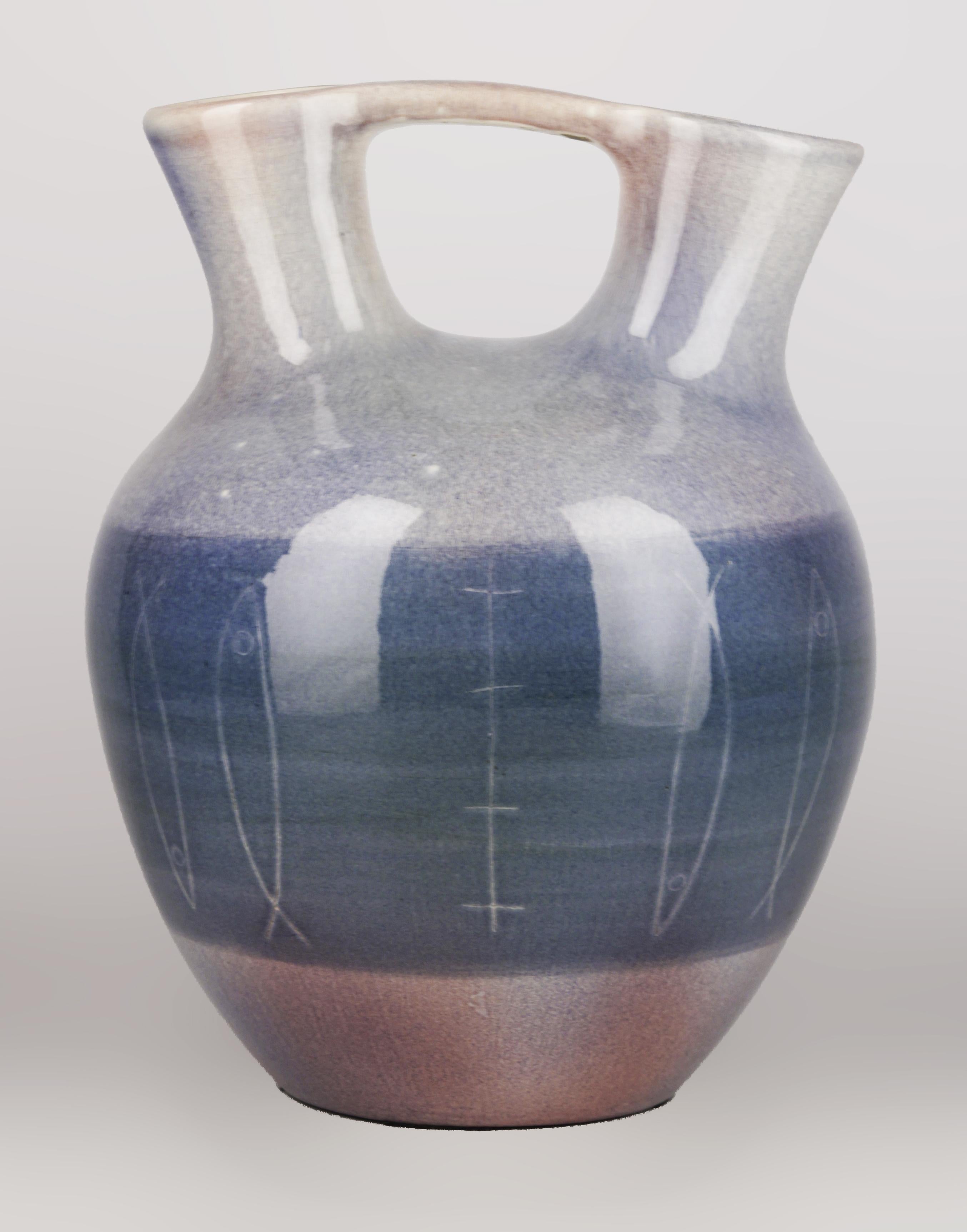 Art Déco italian glazed ceramic vase/amphora with handle and double spout

By: unknown
Material: paint, ceramic
Technique: enameled, glazed, hand-crafted, molded, painted, pressed
Dimensions: 11 in x 14 in
Date: early 20th century
Style: Art