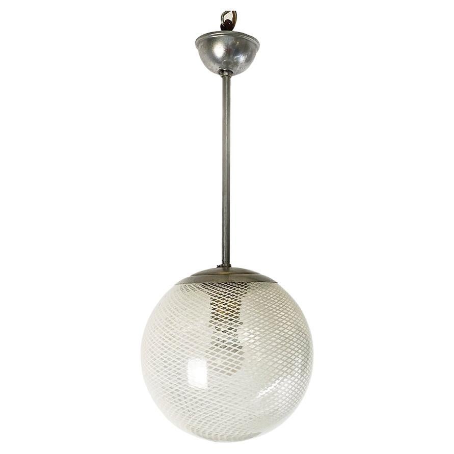 Art Deco Italian mesh glass chandelier with metal stem, 1930s
Suspension lamp with spherical net glass diffuser, with stem and wire cover in aluminum.
1930s
Good condition, plant checked.
Measurements in cm 20x48h.