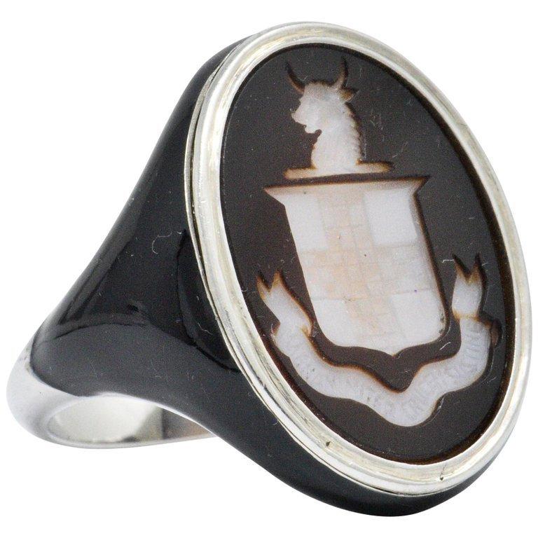 A Very Rare Art Deco Italian Nobility Black and White Agate Intaglio Coat-of-Arms Black Enamel Platinum Signet Ring in Mint Condition.
A size 4. Enamel on platinum is very rare. This can be re-sized by your professional jeweler.