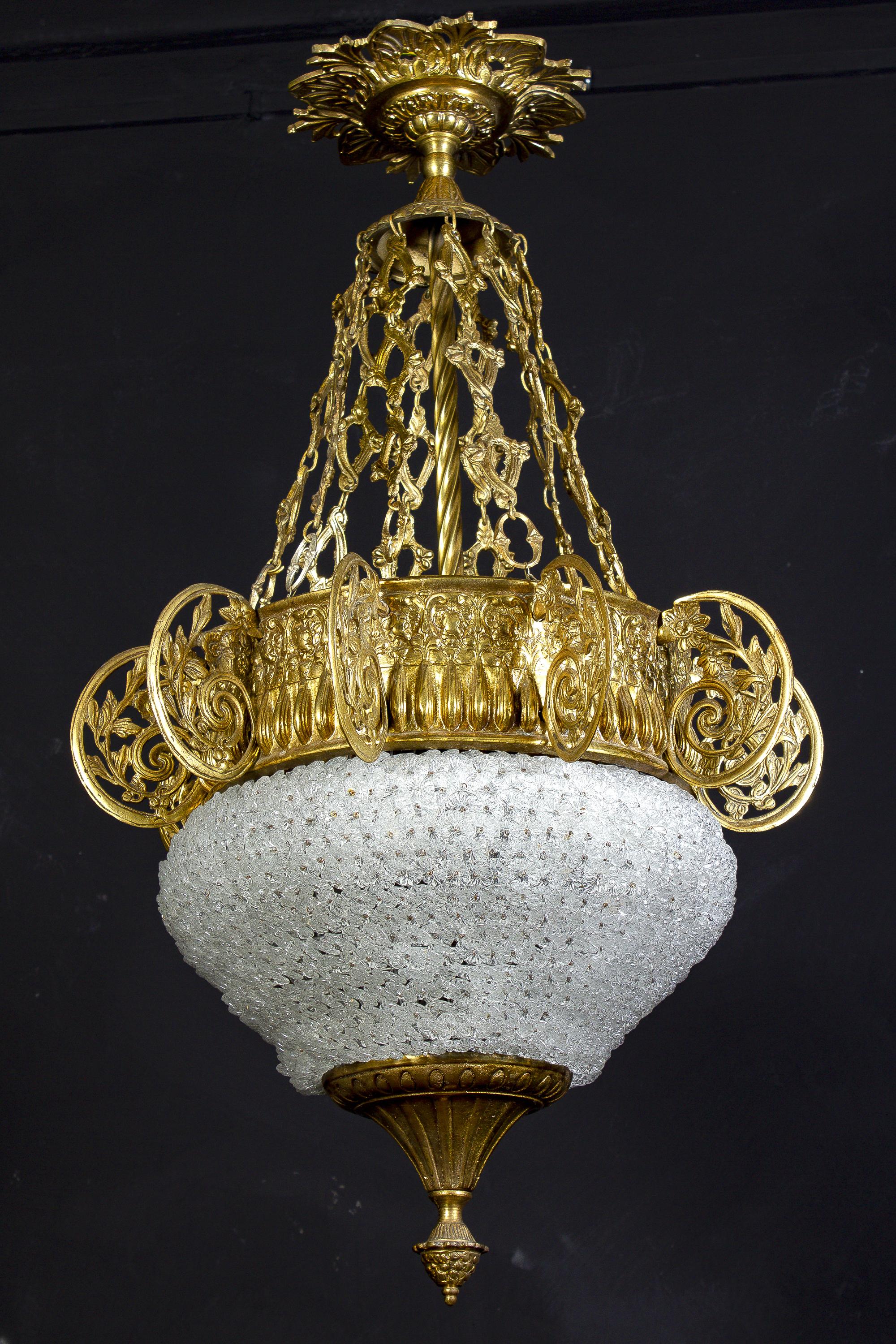 Highly decorative Ormolu mounted Art Deco chandelier, centered by hundreds of delicious small hand blown Murano glass flowers. Beautiful scrolled ormolu elements and chain terminating in a finely decorated canopy.
Six E27 light bulbs suitable for