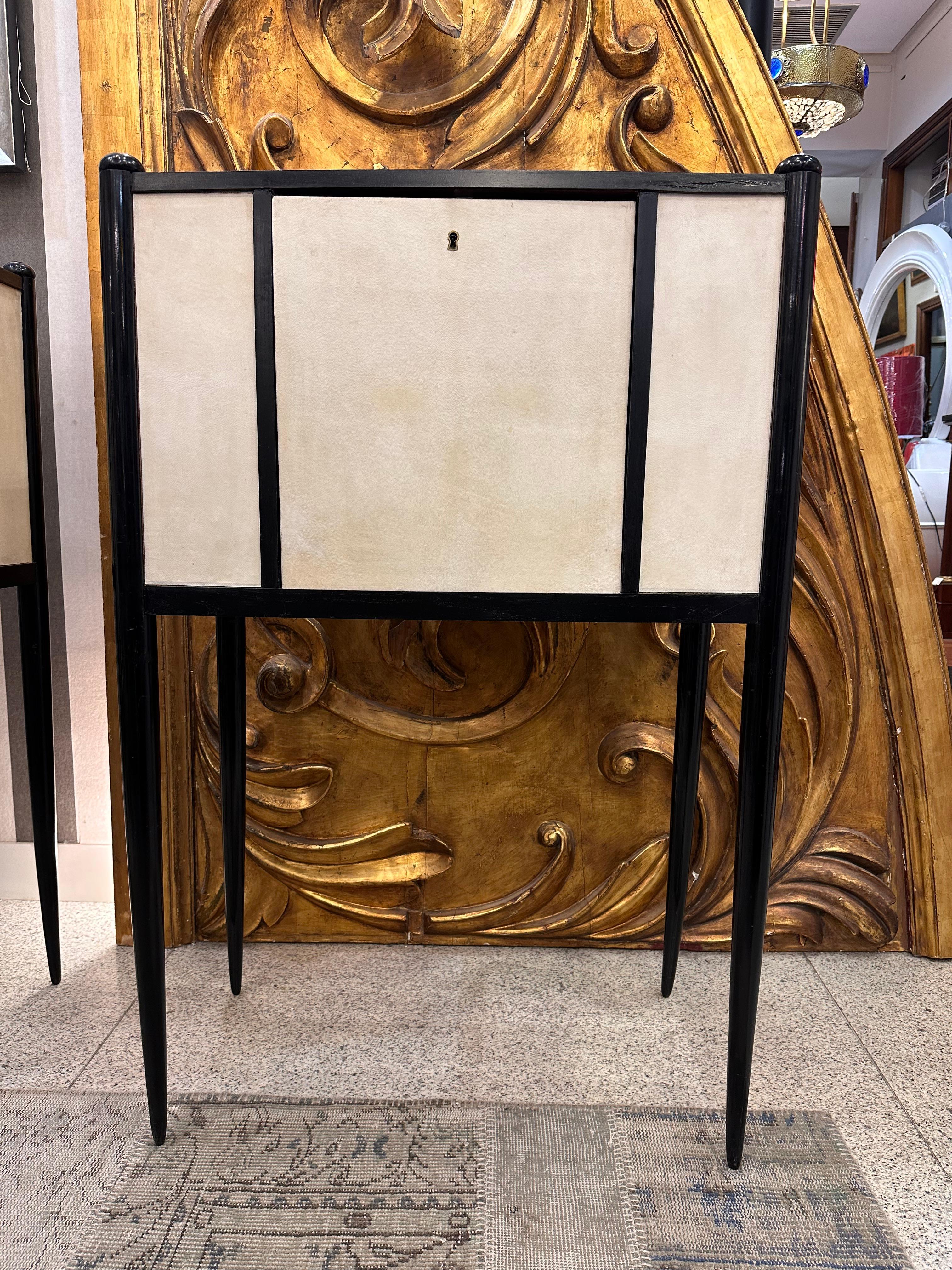 One of a kind pair of  cabinet-secretaire in black lacquer  wood and parchement  attibuted to Paolo Buffa (Milan, Italy, 1903-1970).

The furniture designed by the Milanese architect and designer Paolo Buffa is often unique, based on the needs of