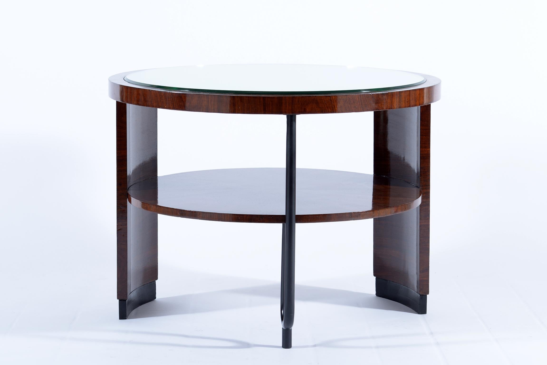 Double shelve round Art Deco Italian side or occasional table in precious wood and feet in black lacquered wood. The top is in mirror and the third leg is in black metal. Produced in the 1930s this table falls into the 