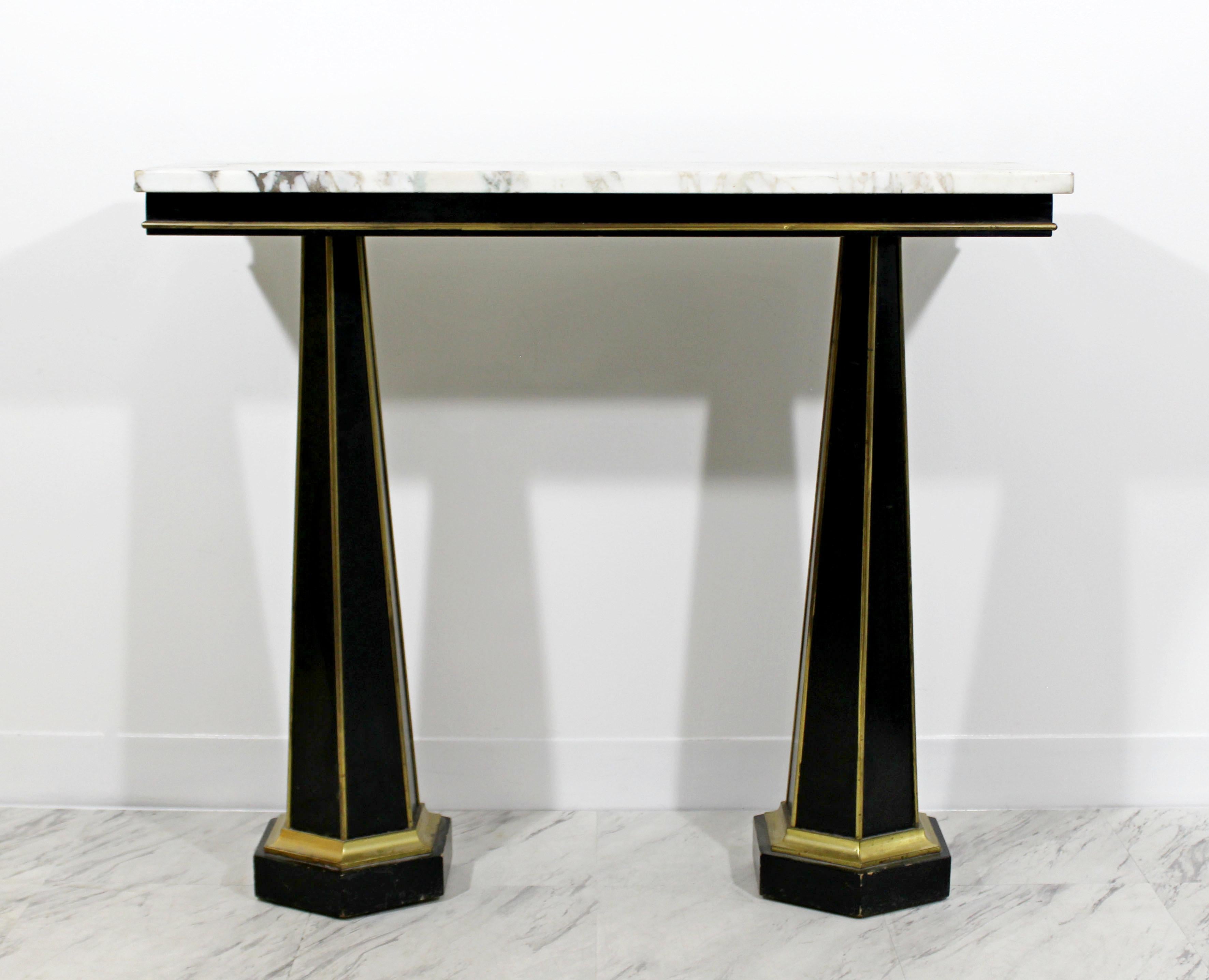 For your consideration is an absolutely stunning Italian Art Deco white marble topped console table, with black and gold ebonized base, circa 1930s. In excellent condition. The dimensions are 36